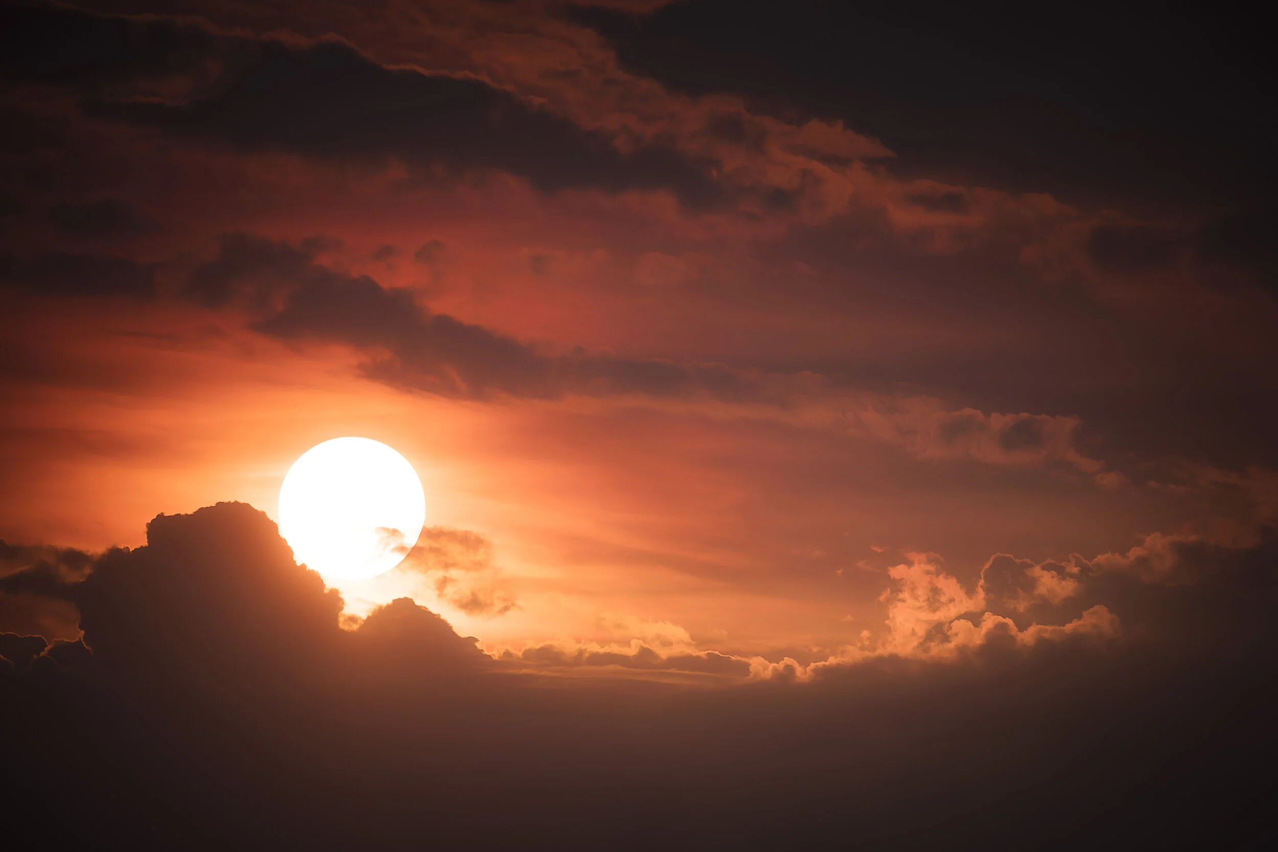 Dramatic afternoon light breaking through dark clouds