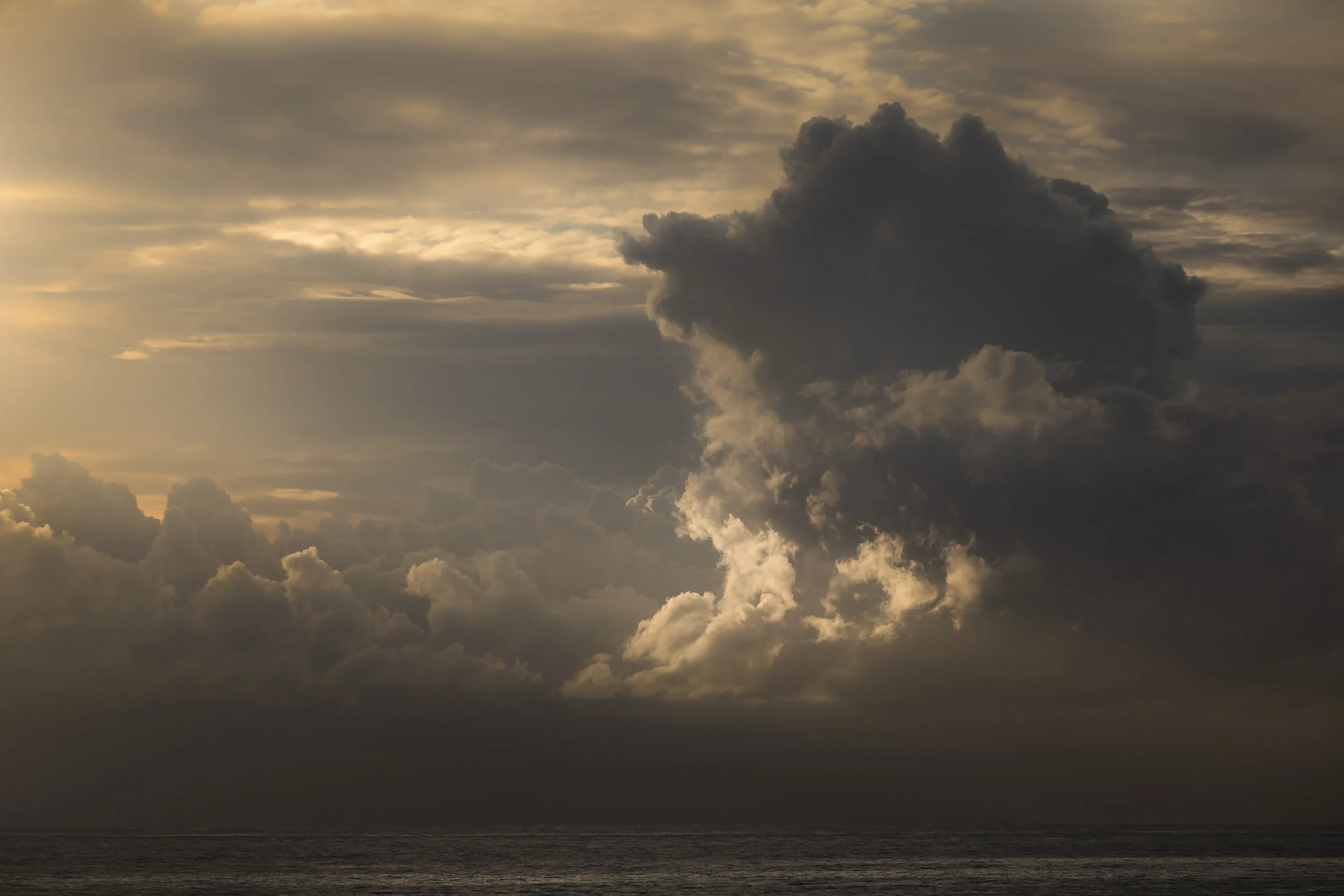 Dramatic clouds at sunrise over the ocean