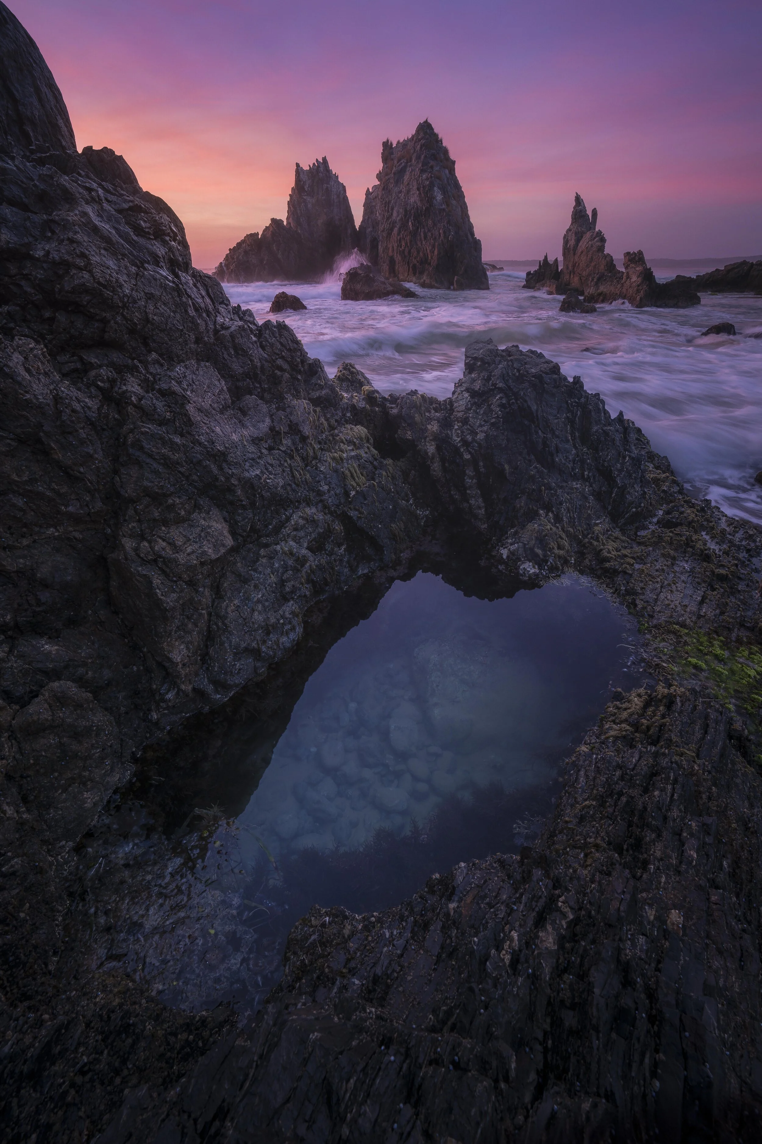 Sunrise at Camel Rock with a rock pool in the foreground, New South Wales