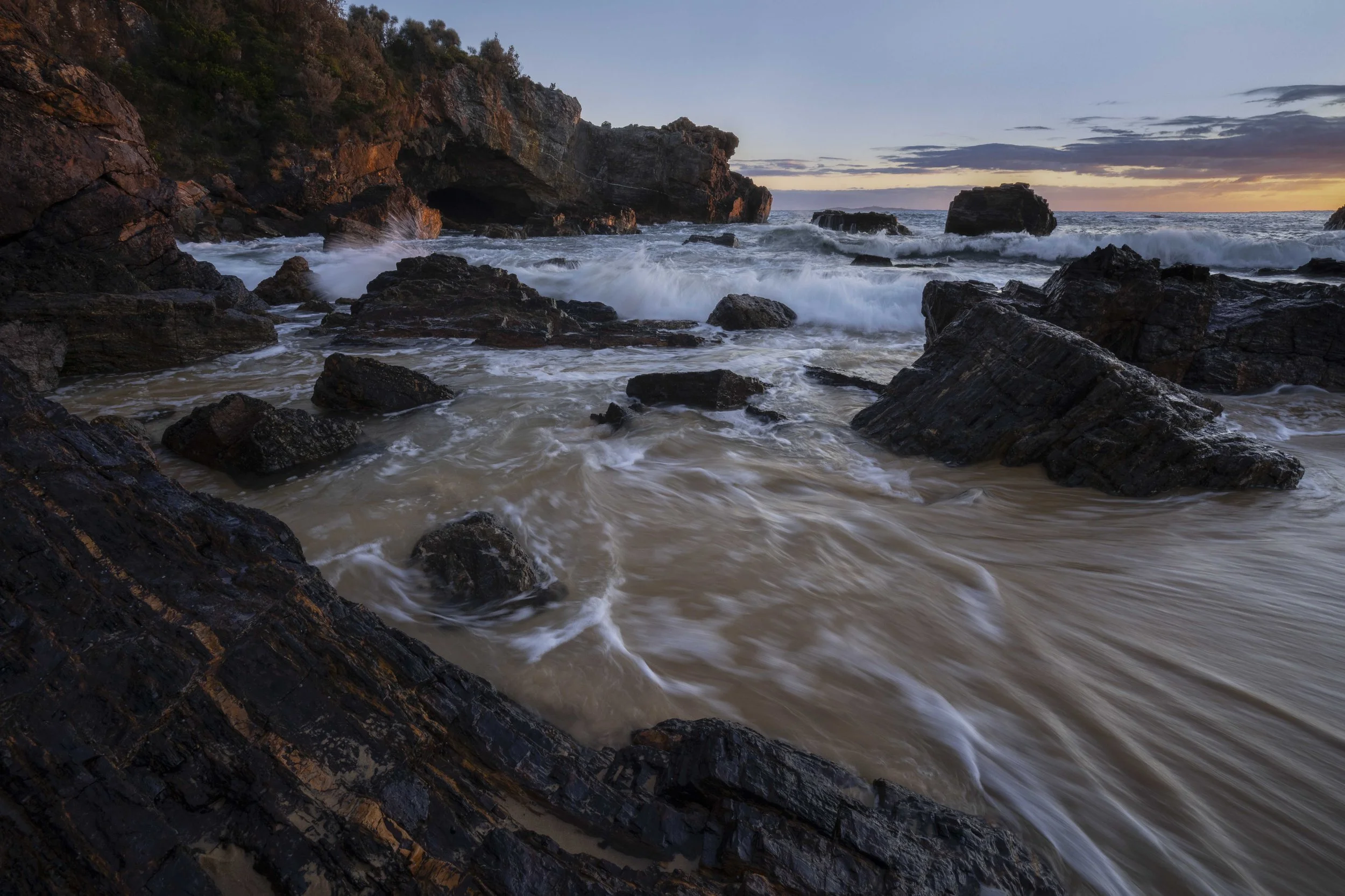 Early morning light on the shoreline and rocks at Mystery Bay