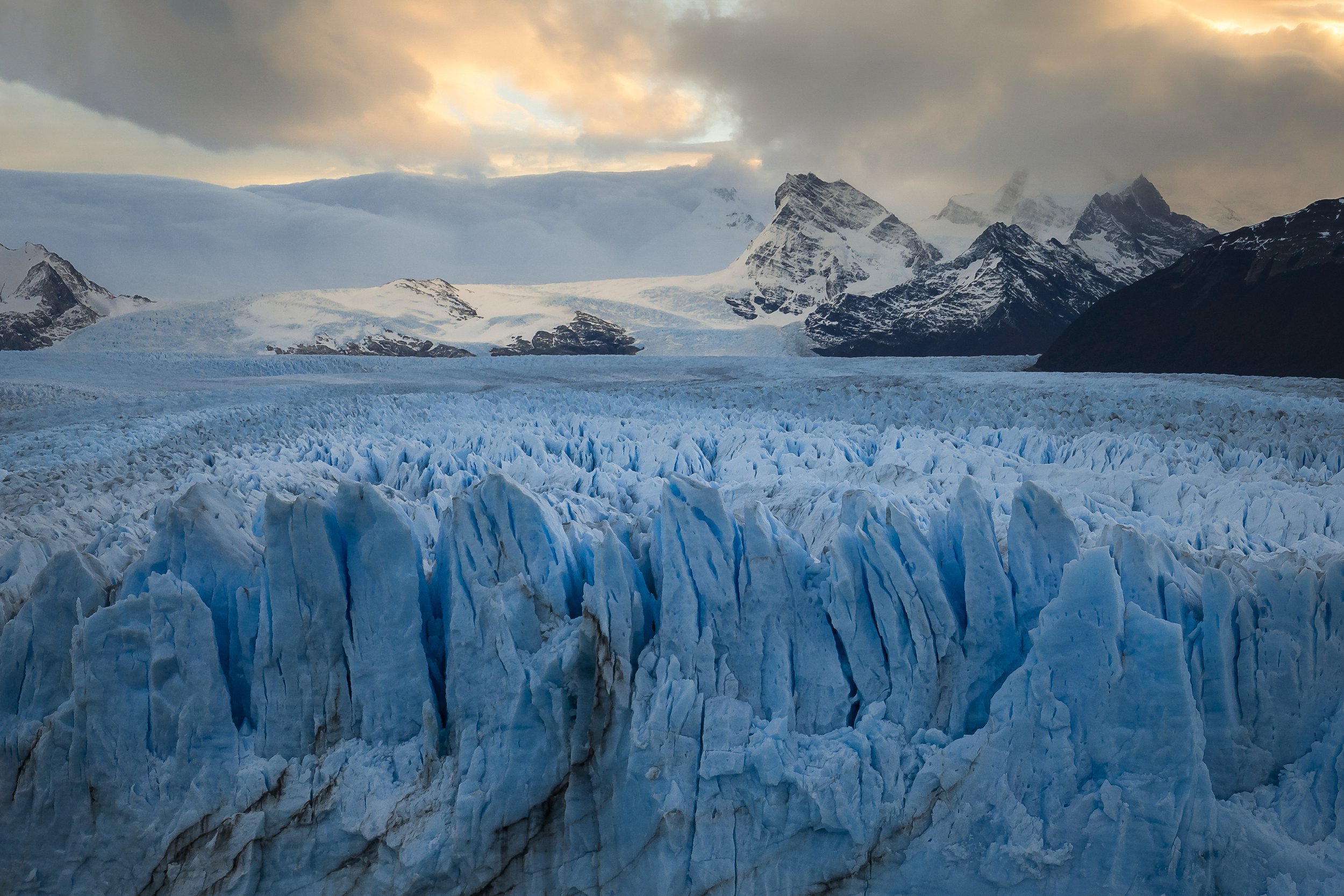 Sunset over the Patagonian Icefield with glaciers and rugged icy peaks bathed in warm light