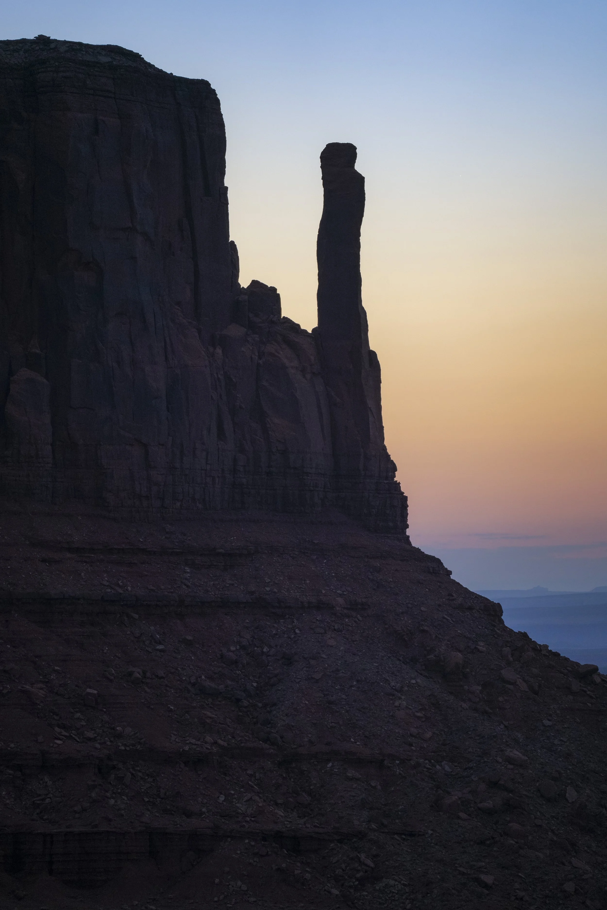 Pastel sunrise over West Mitten Butte in Monument Valley, Arizona