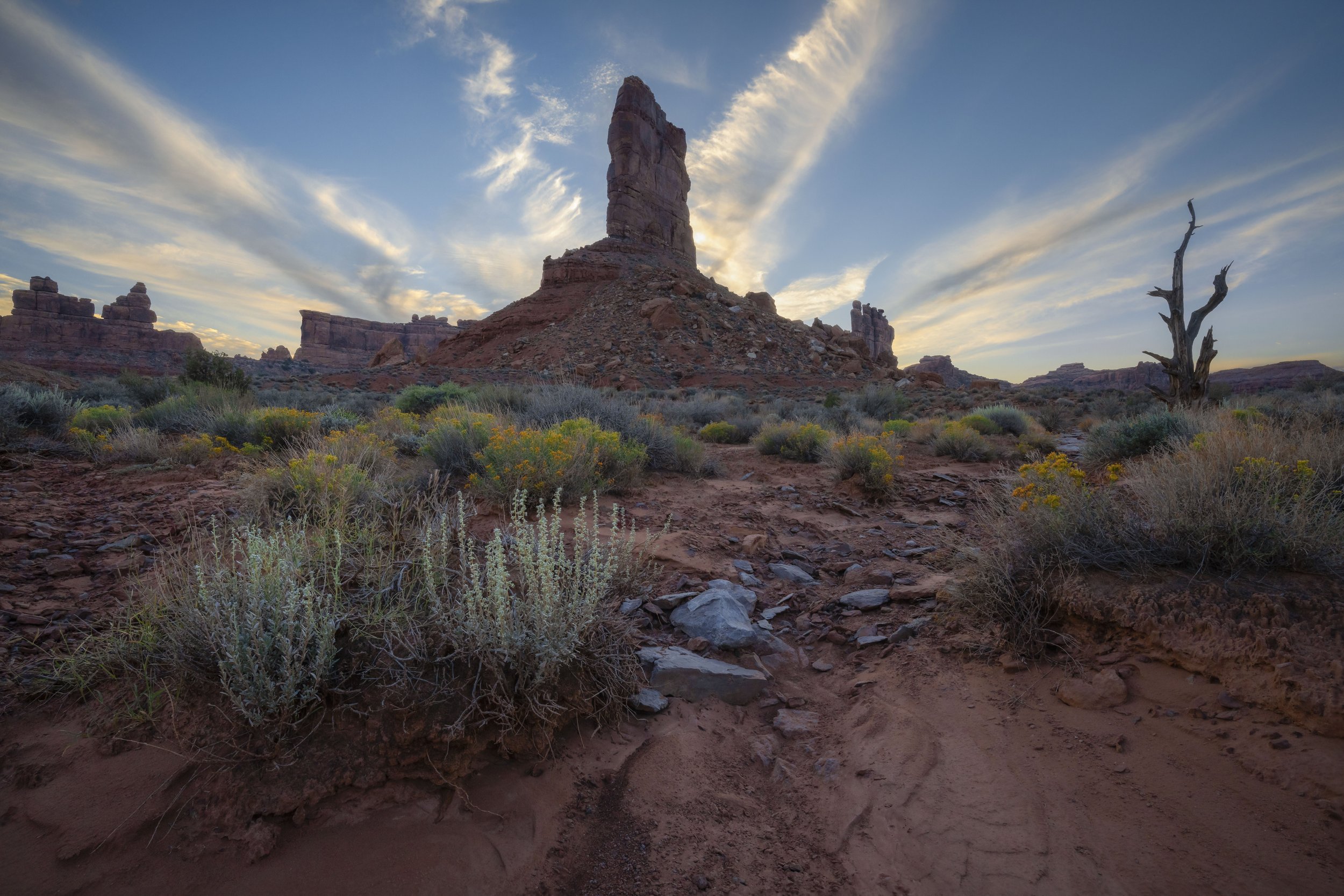 Vibrant sunset illuminating the sandstone spires and desert terrain of Valley of the Gods in Utah, USA