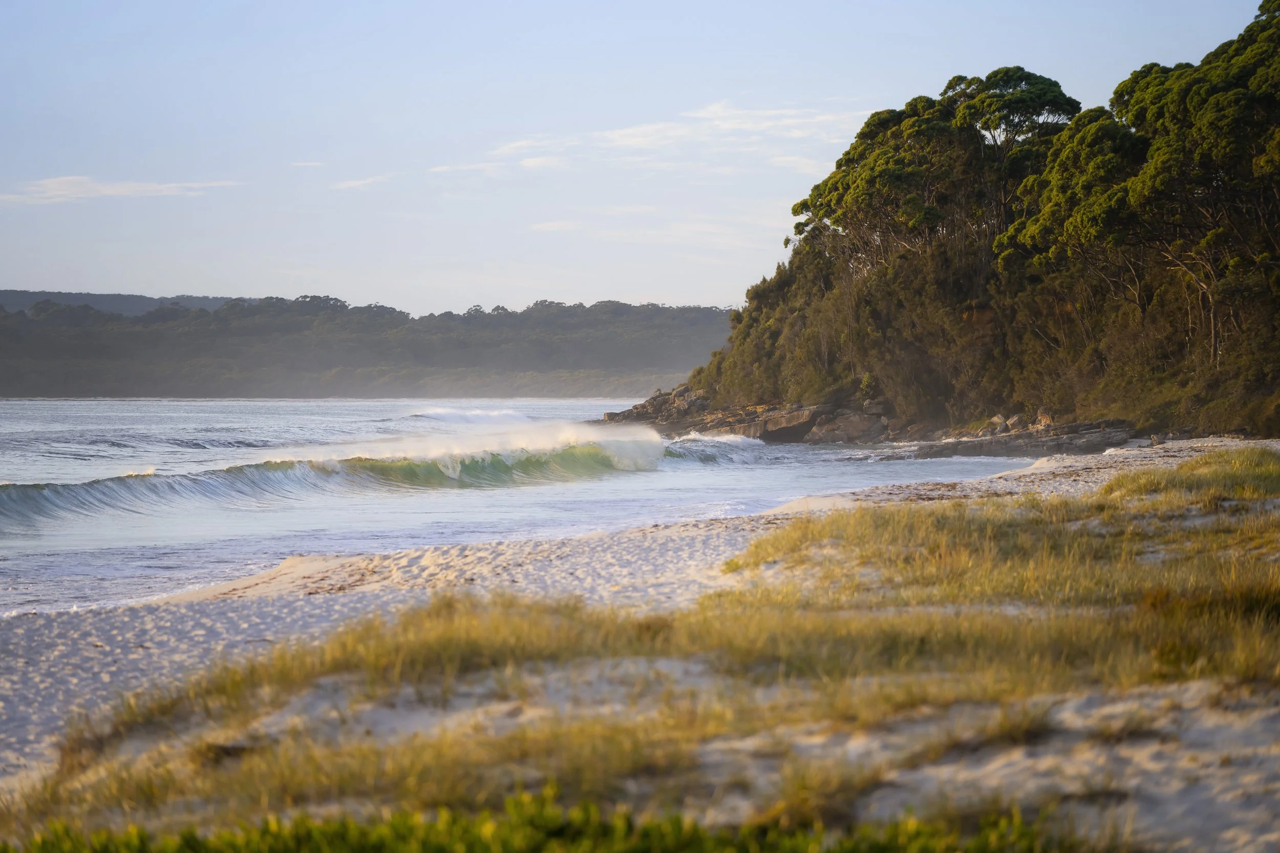 Powerful ocean waves breaking along the sands of Hyams Beach