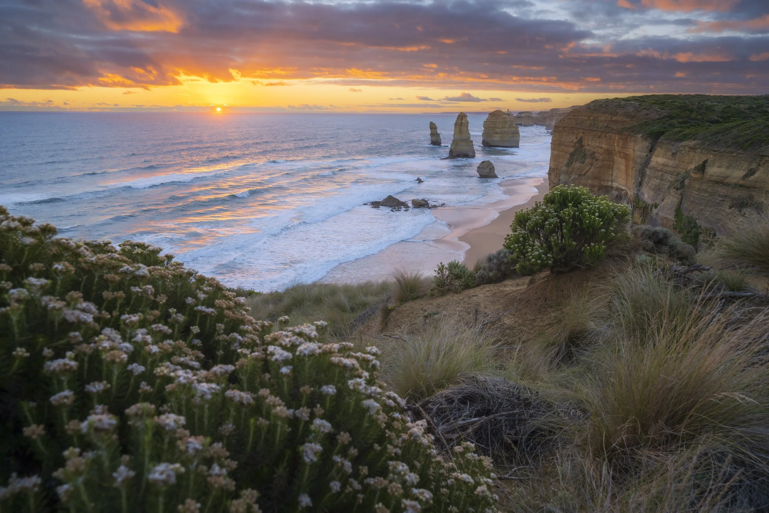 The Twelve Apostles rock formations along the Great Ocean Road at sunset