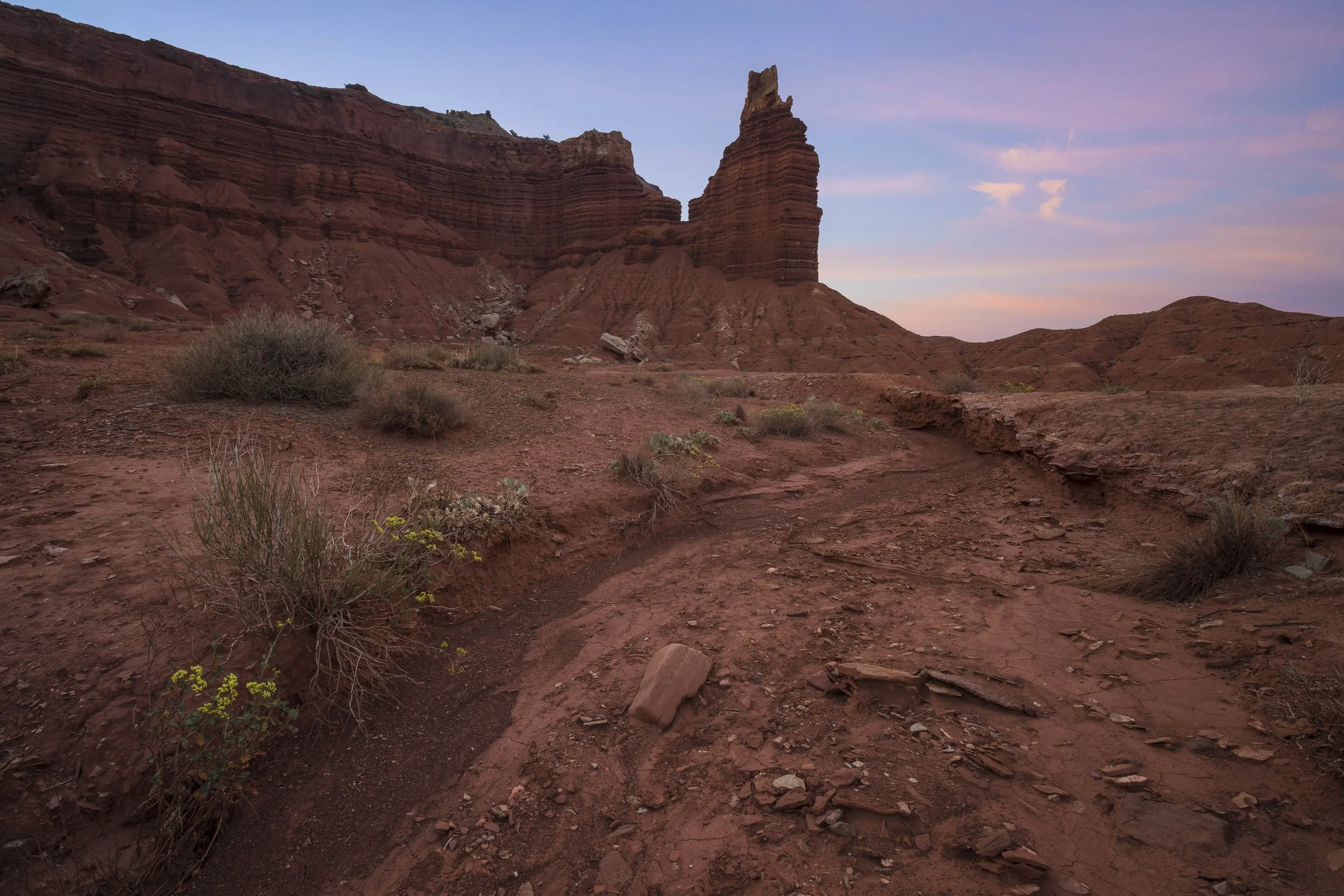 Hanskville’s Chimney Rock at sunrise, showing the sandstone spire and surrounding desert landscape