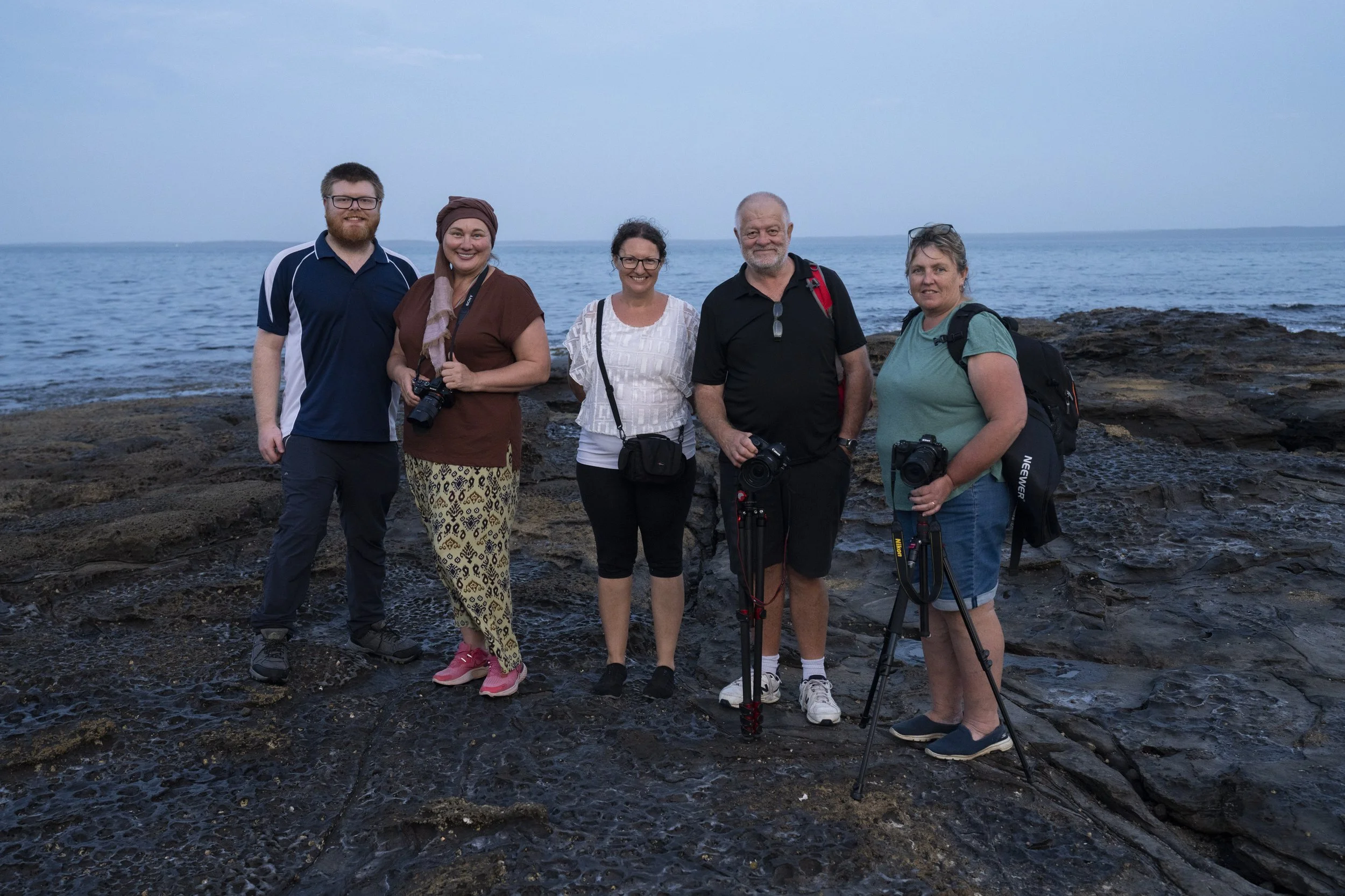 Photography workshop participants posing together after an outdoor session, Jervis Bay, NSW