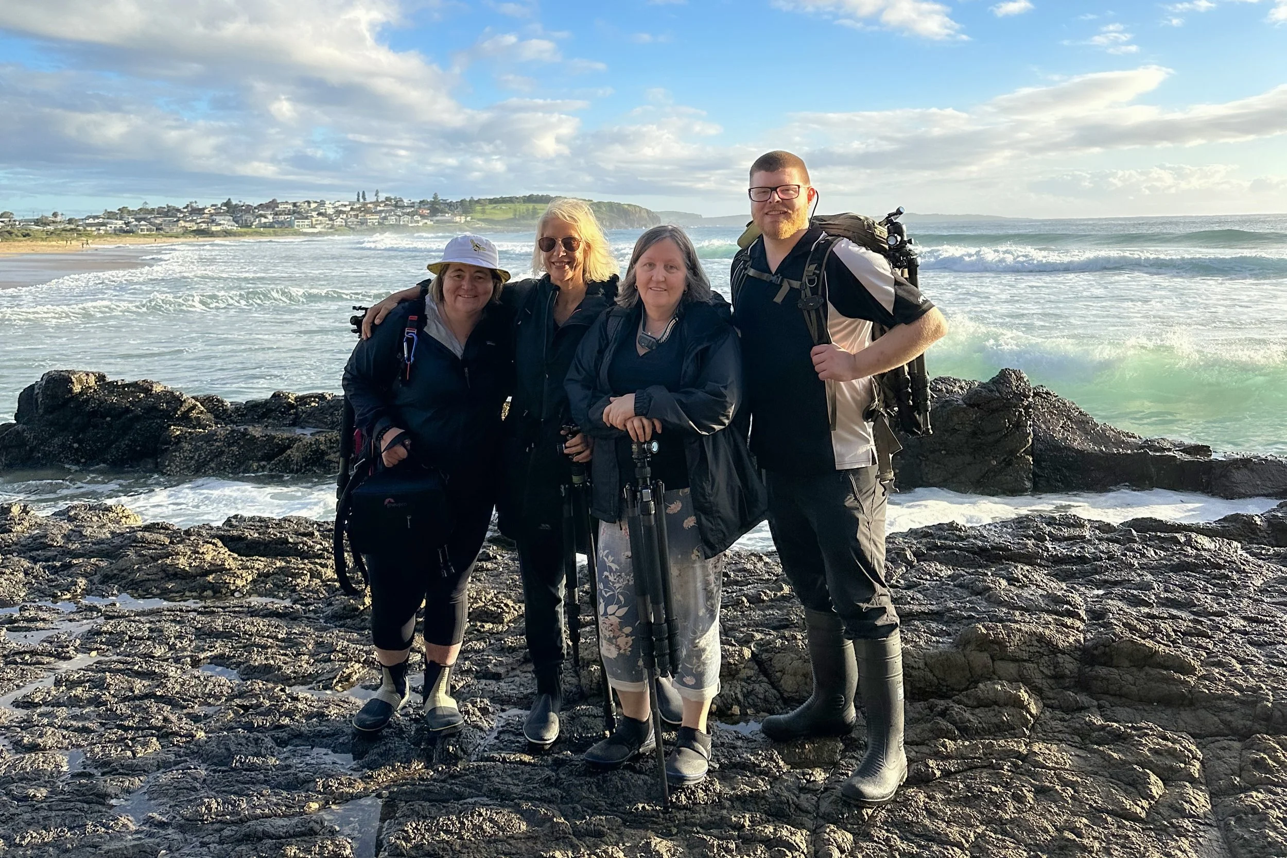 Photography workshop participants posing together after an outdoor session, Kiama, NSW