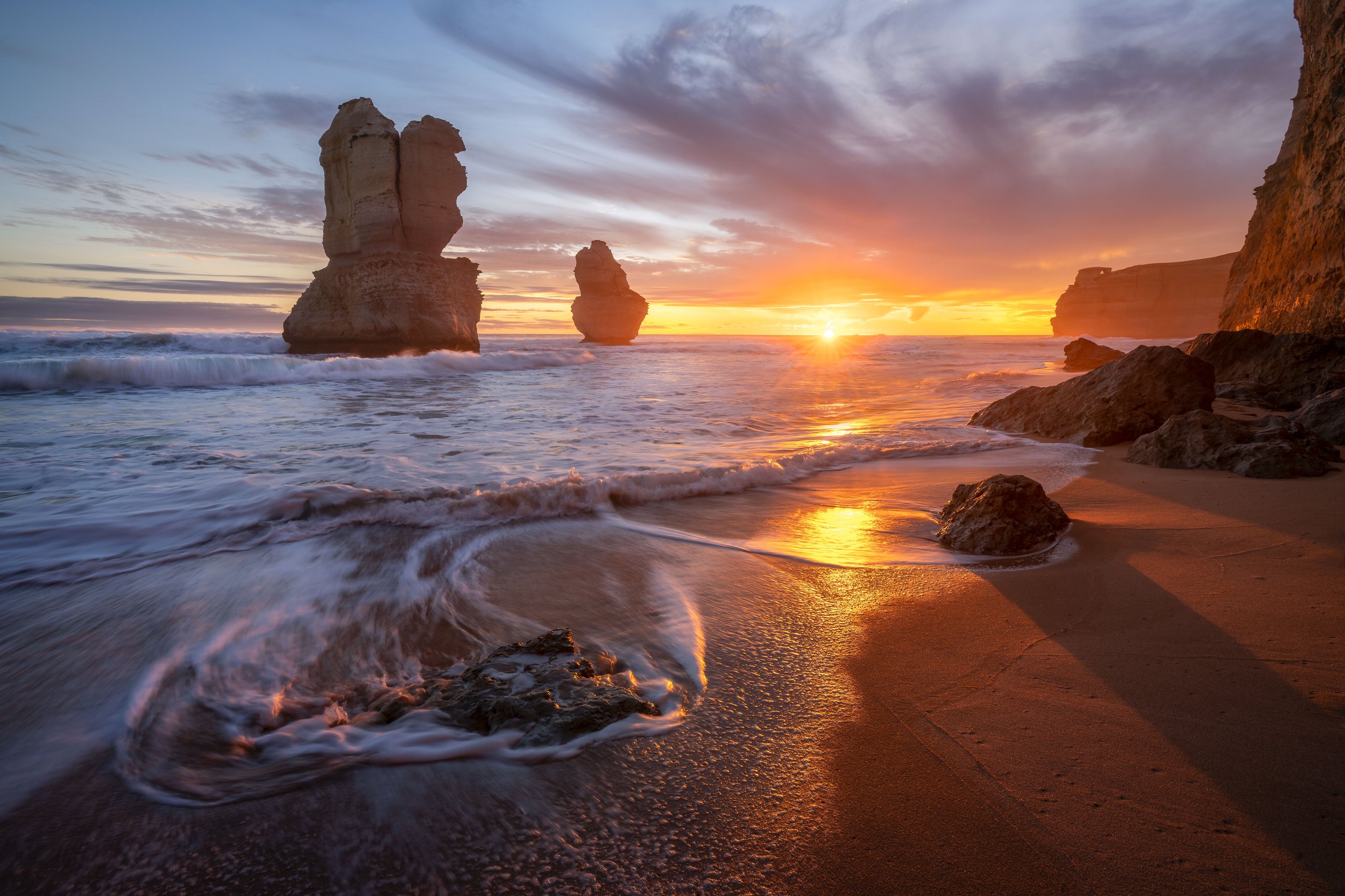 Golden light of sunset illuminating the cliffs at Gibson Steps