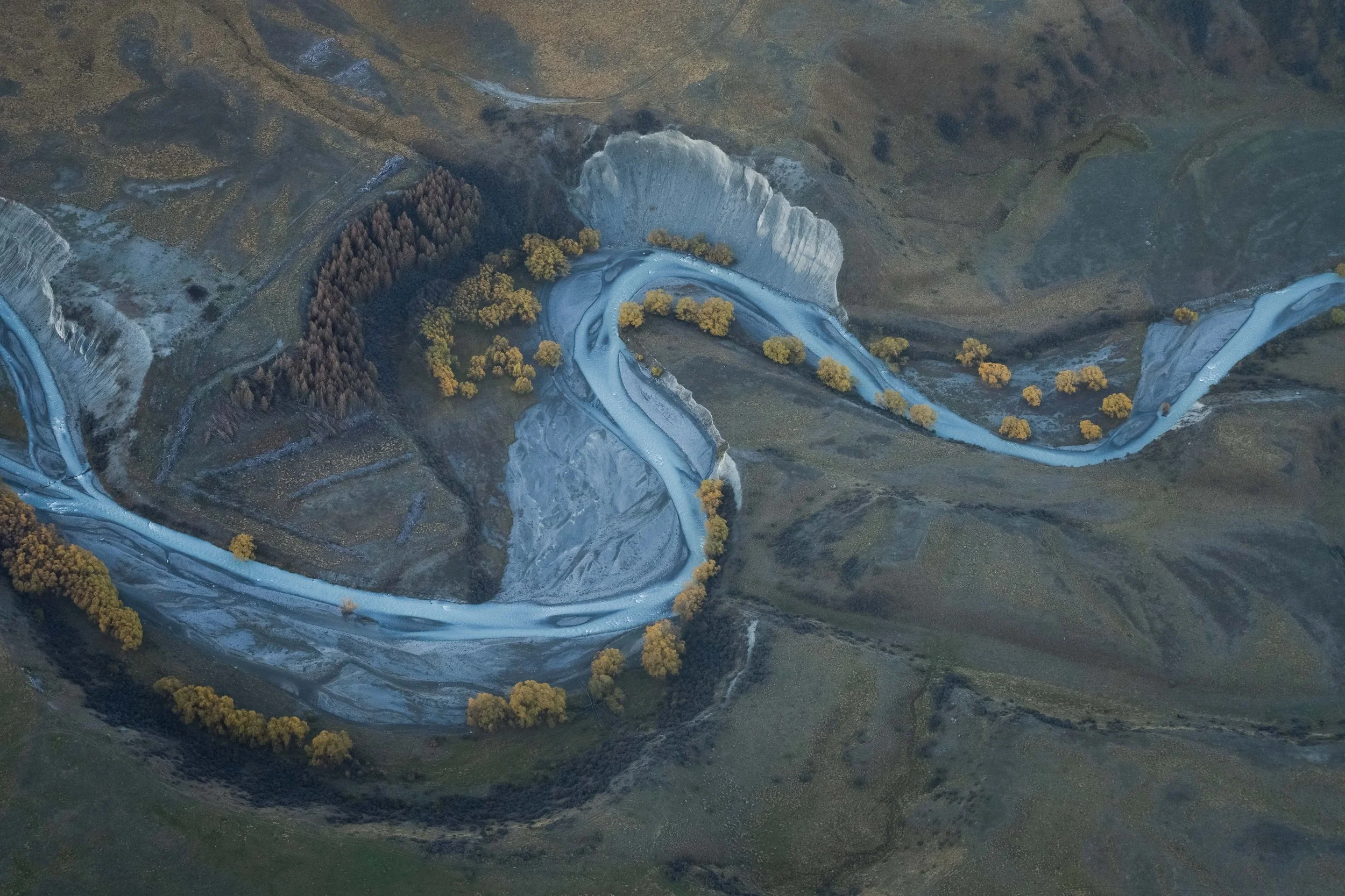 Aerial view of a glacier river shaped like a seahorse