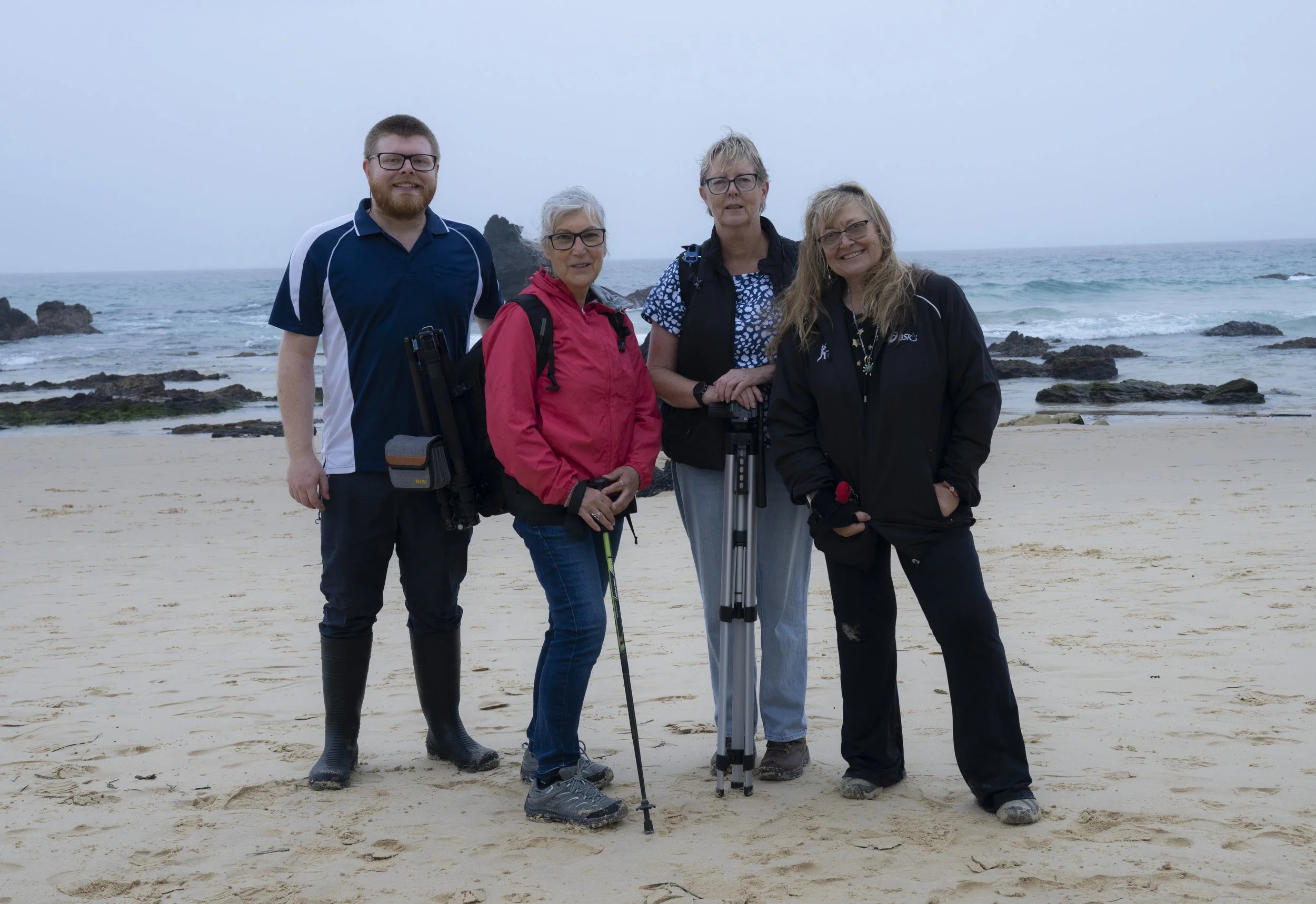 Photography workshop participants posing together after an outdoor session
