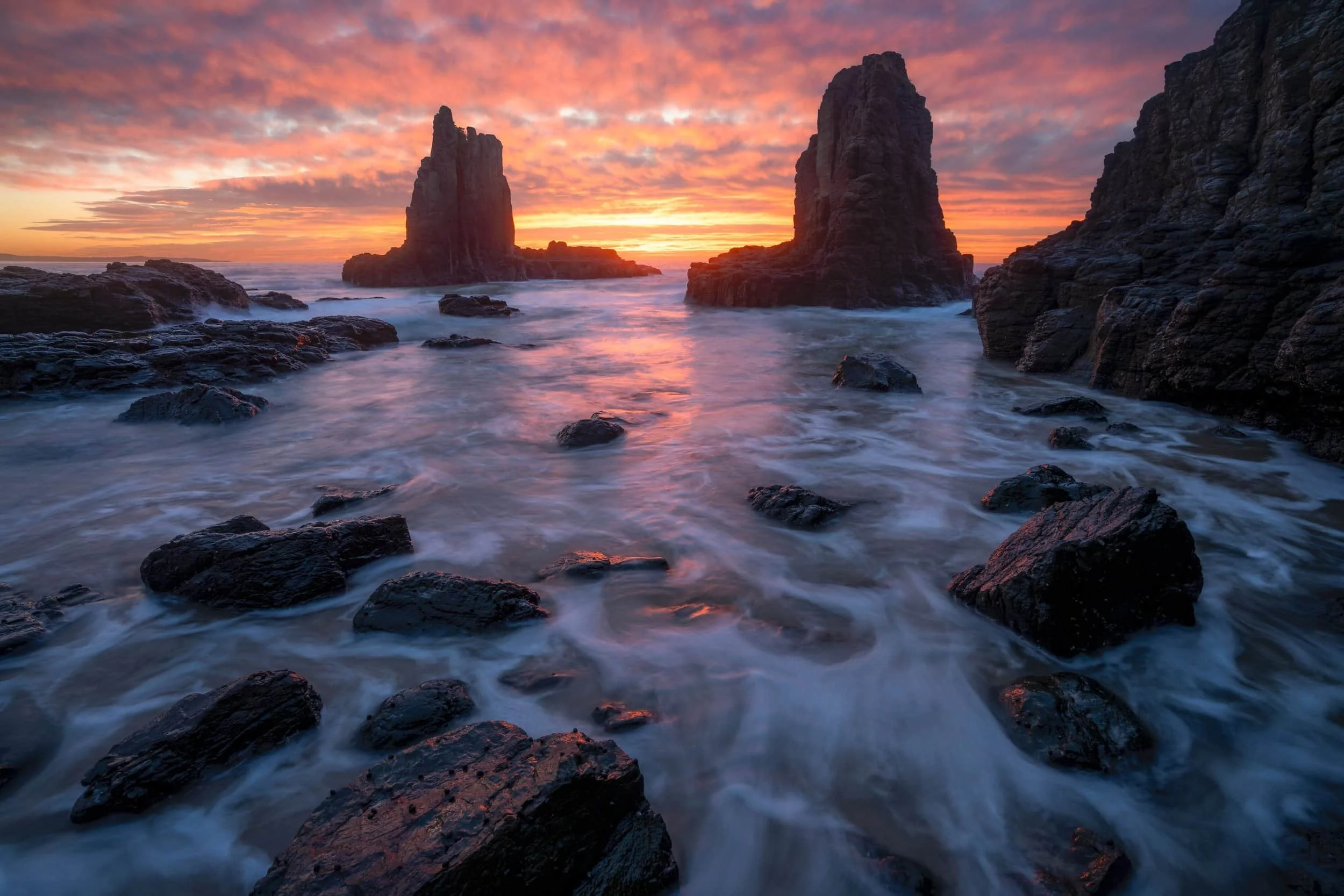 A dramatic sunrise over Cathedral Rocks, Kiama, NSW, Australia