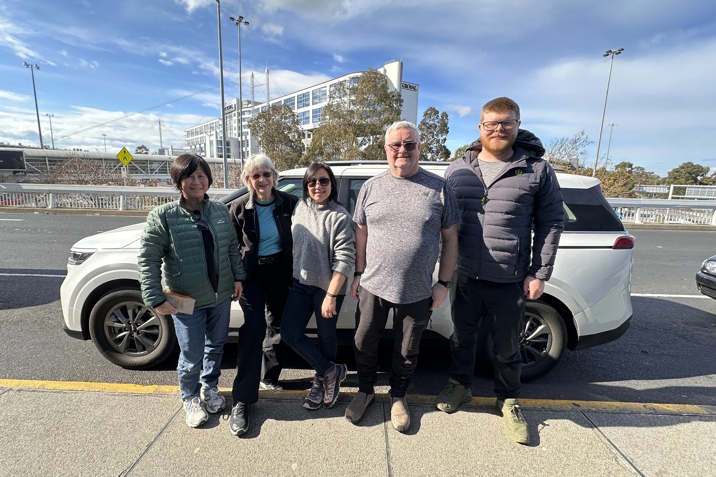 Photography workshop participants posing together after an outdoor session, Great Ocean Road, VIC