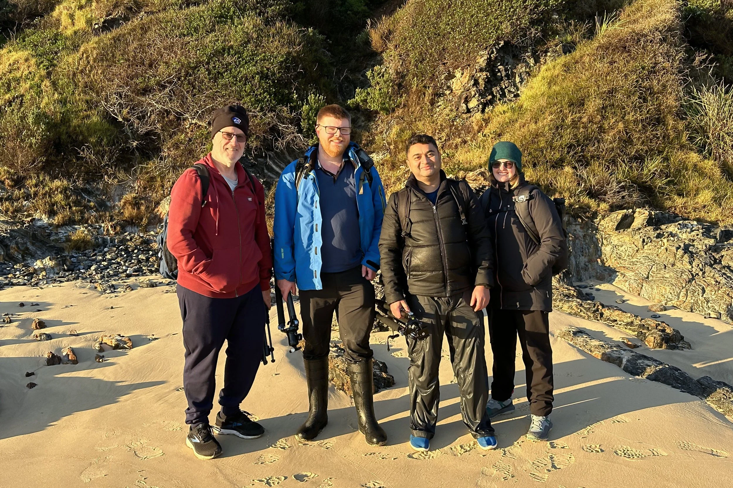 Photography workshop participants posing together after an outdoor session, Narooma, New South Wales