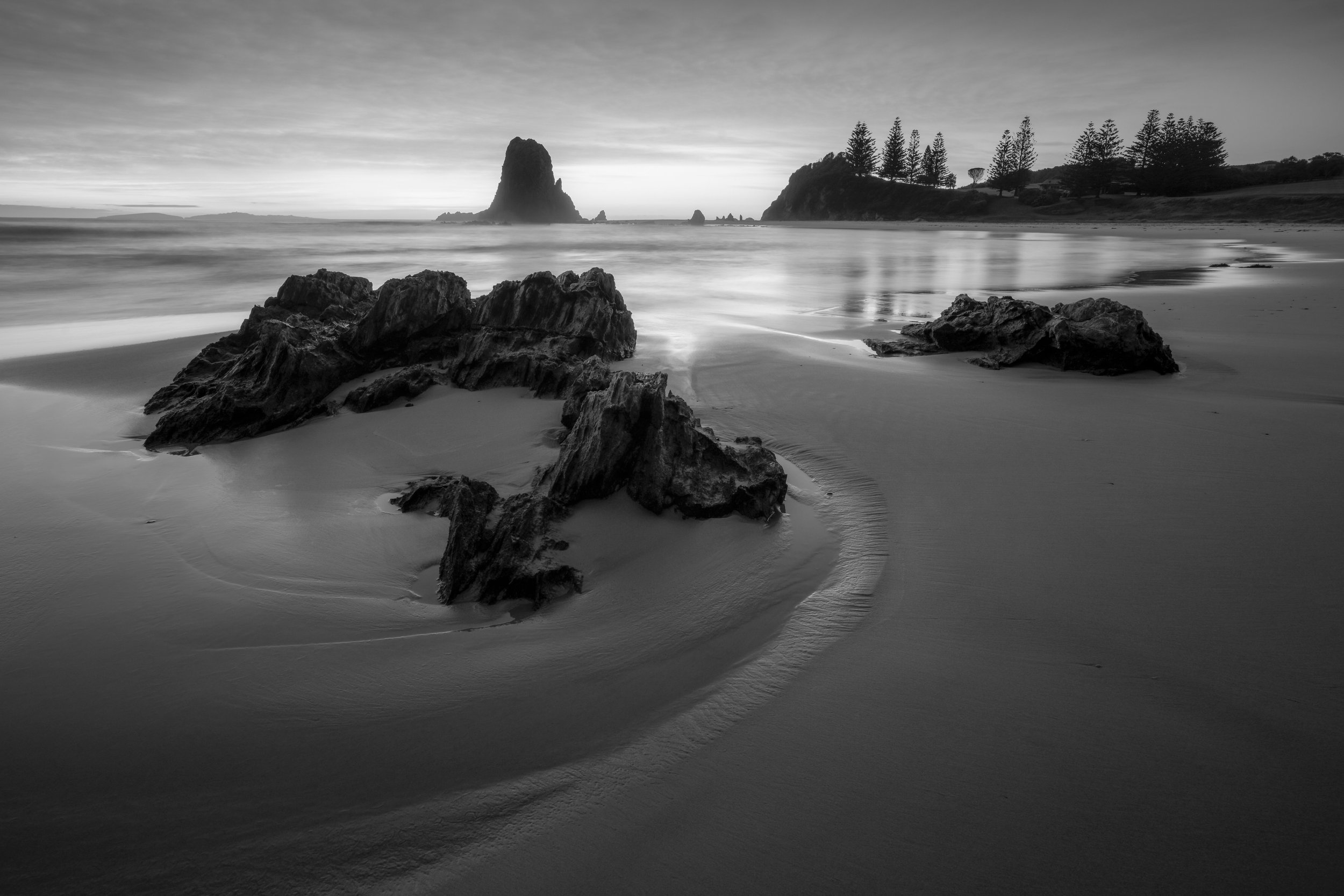 Dramatic black and white image of the cliffs and rock formations at Glasshouse Rocks