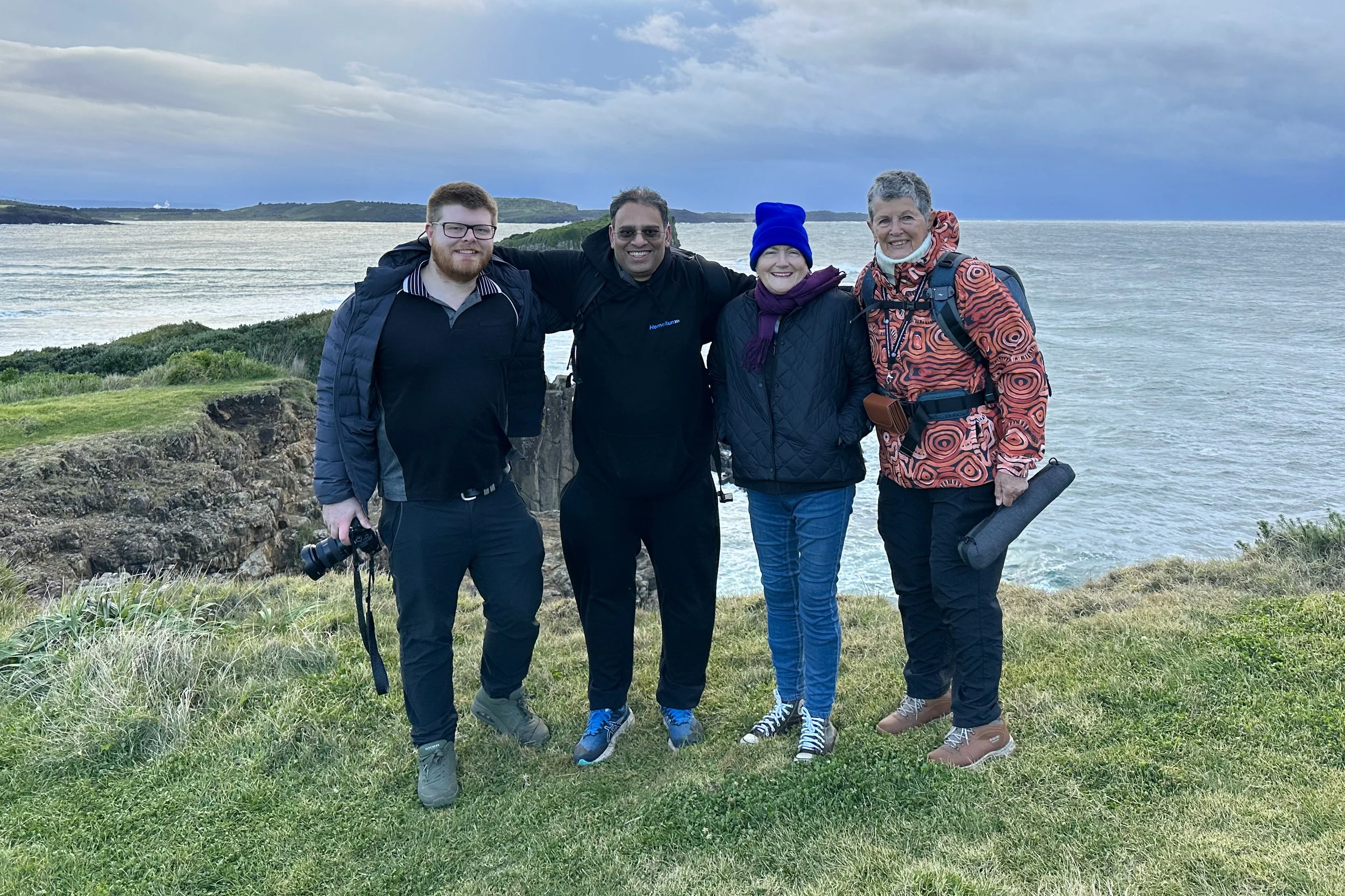 Photography workshop participants posing together after an outdoor session, Bombo Quarry, Kiama, NSW