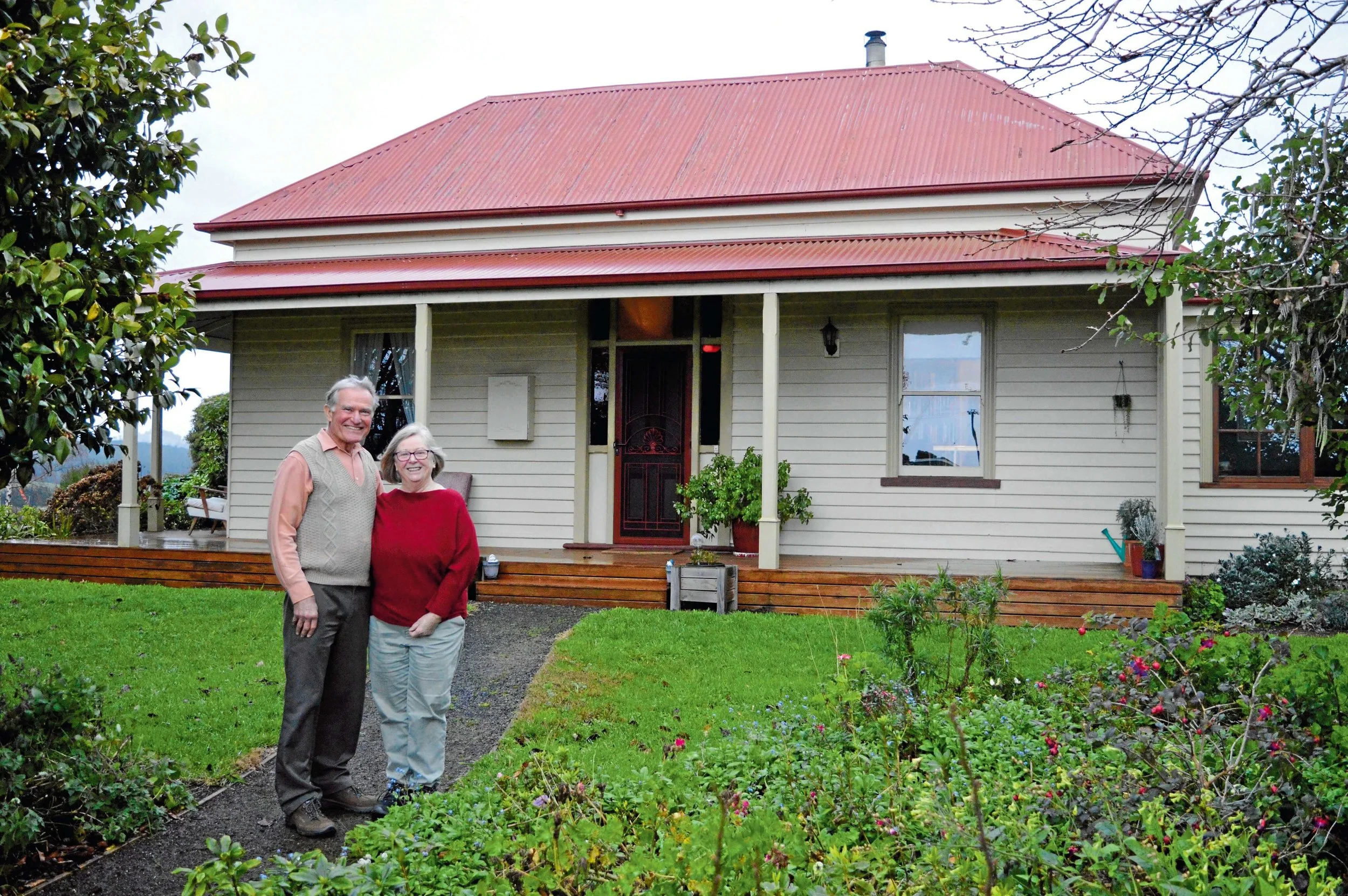 • Ian and Ann Wilson in front of Summerhill in North Scottsdale, which was built in 1908.