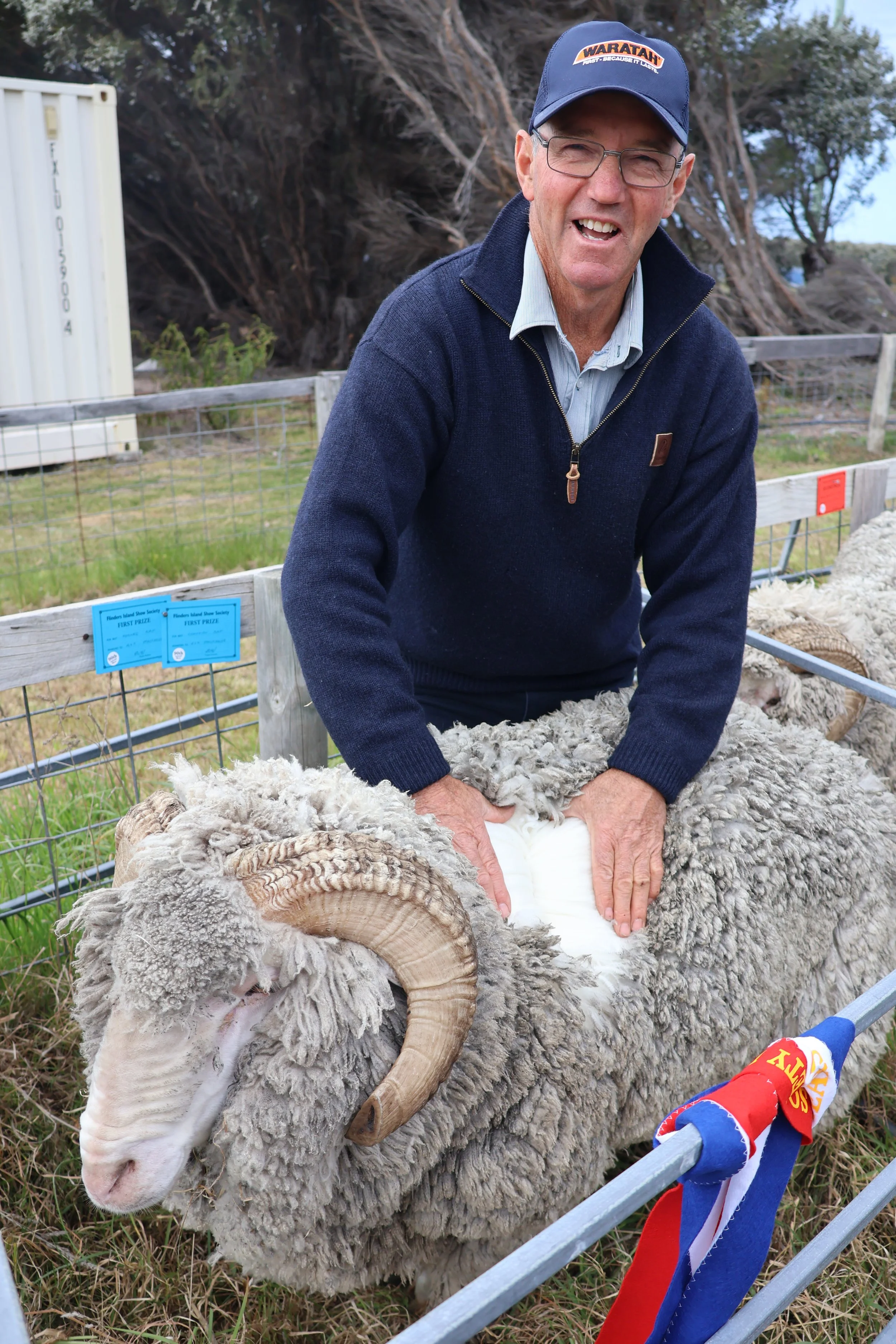 *Steward Martin Walker with Allan and Tracey Stackhouse's champion ram.JPG