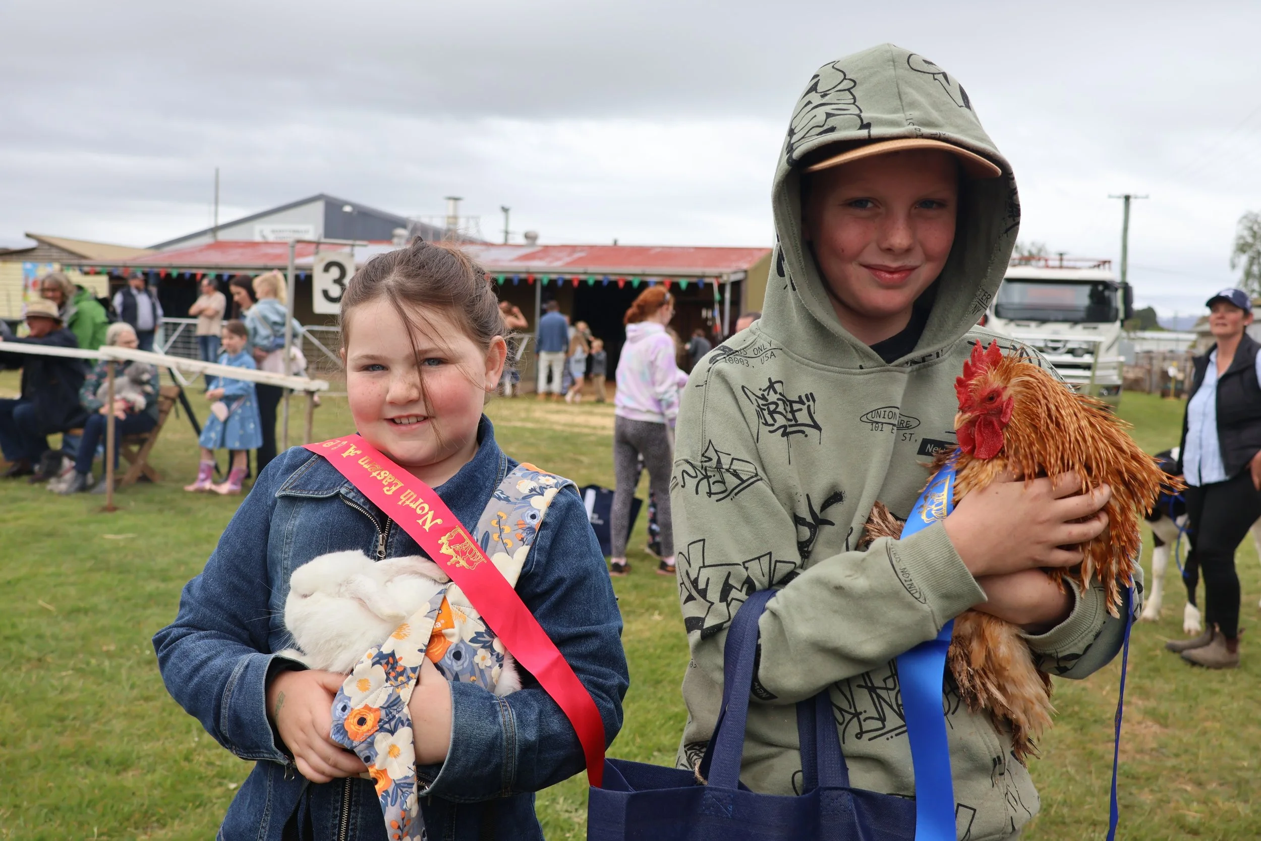 Zaylee Jackson with Snowball from Scottsdale and Kye Campbell with Frizzle the rooster from Ringarooma after the best small pet category.JPG