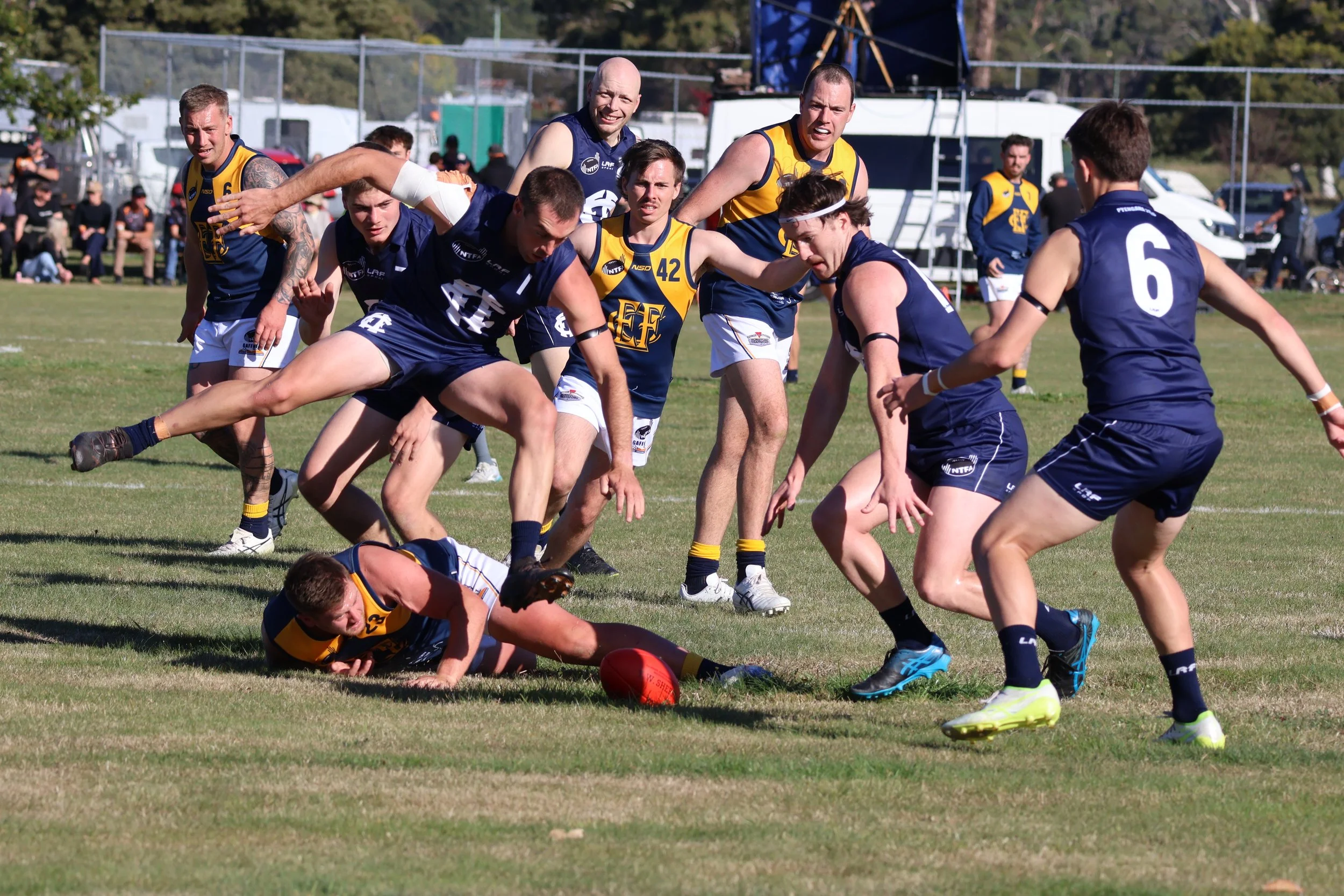 Captain Marcus Haley leaping over his opponent to get the ball.JPG