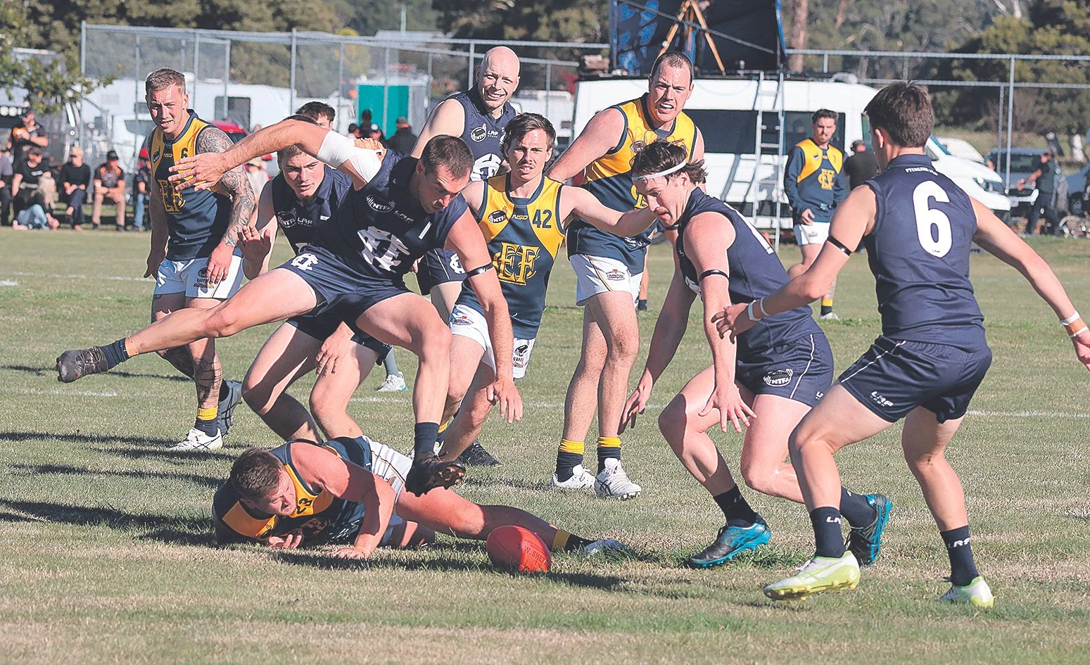 Captain Marcus Haley leaping over his opponent to get the ball.jpg