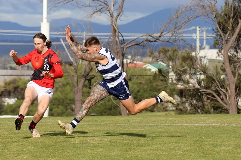 Cal Mulder makes his presence felt as Jonty Nicolson gets a kick away from the Seagulls' forward line.JPG