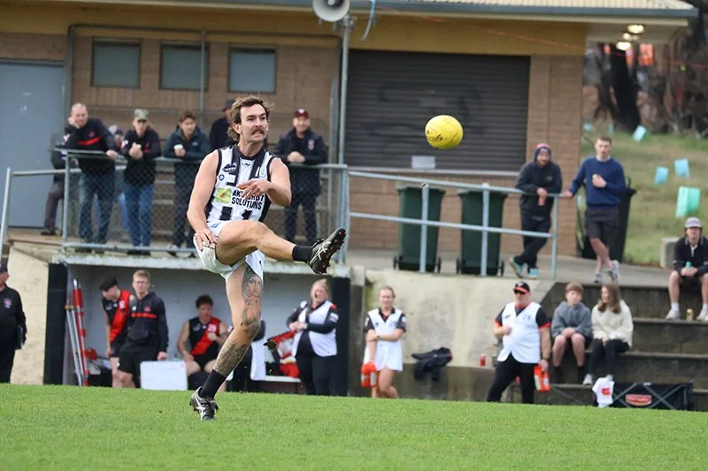 Jacob Singline boots the ball forward in the third quarter.JPG