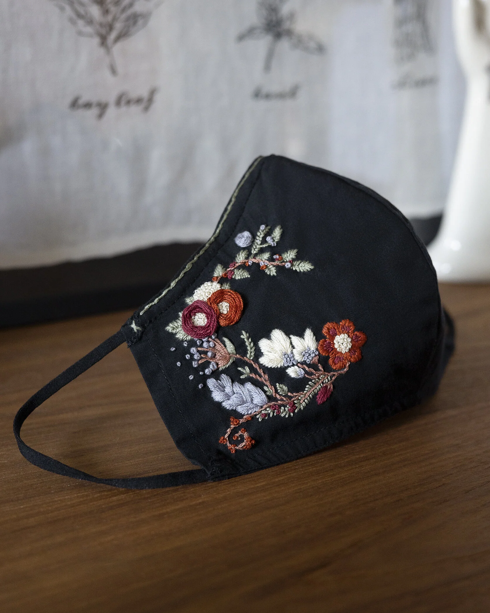 Hand embroidered face mask. Flower embroidery decoration.