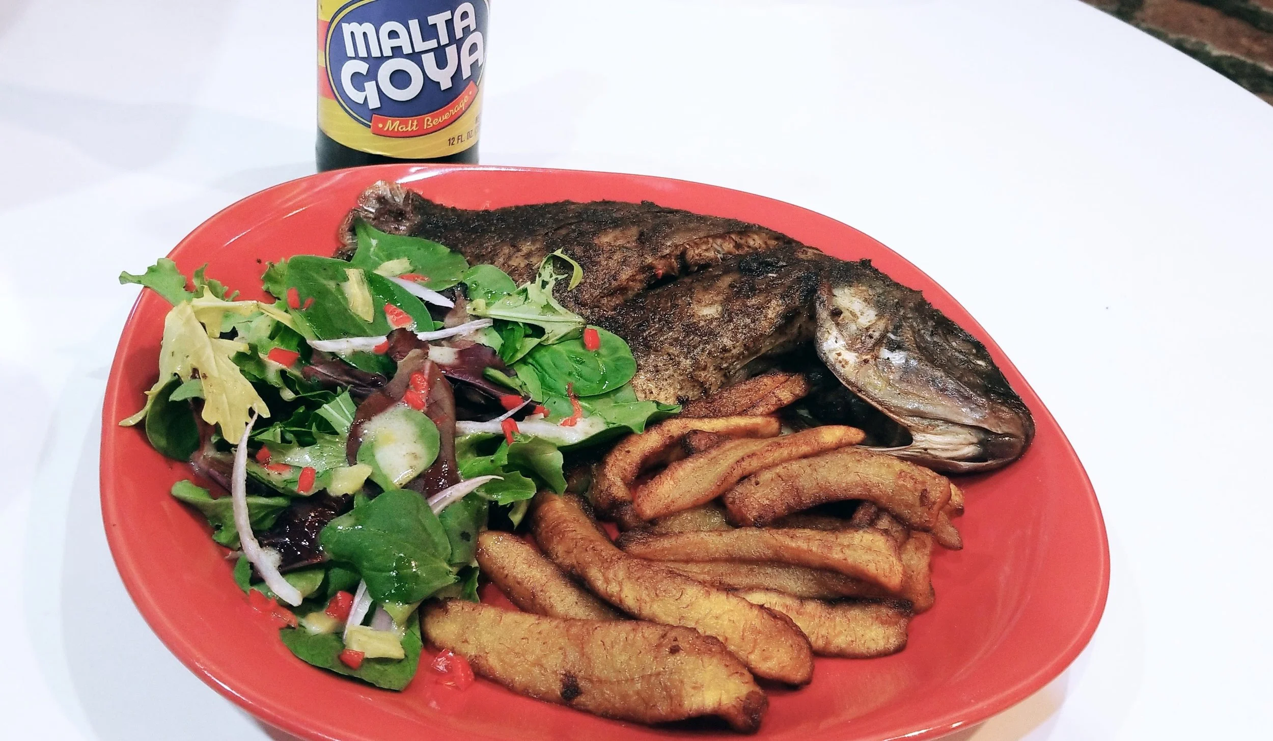 Whole Grilled Tilapia, Fried Plantains, Arugula & Ginger Salad