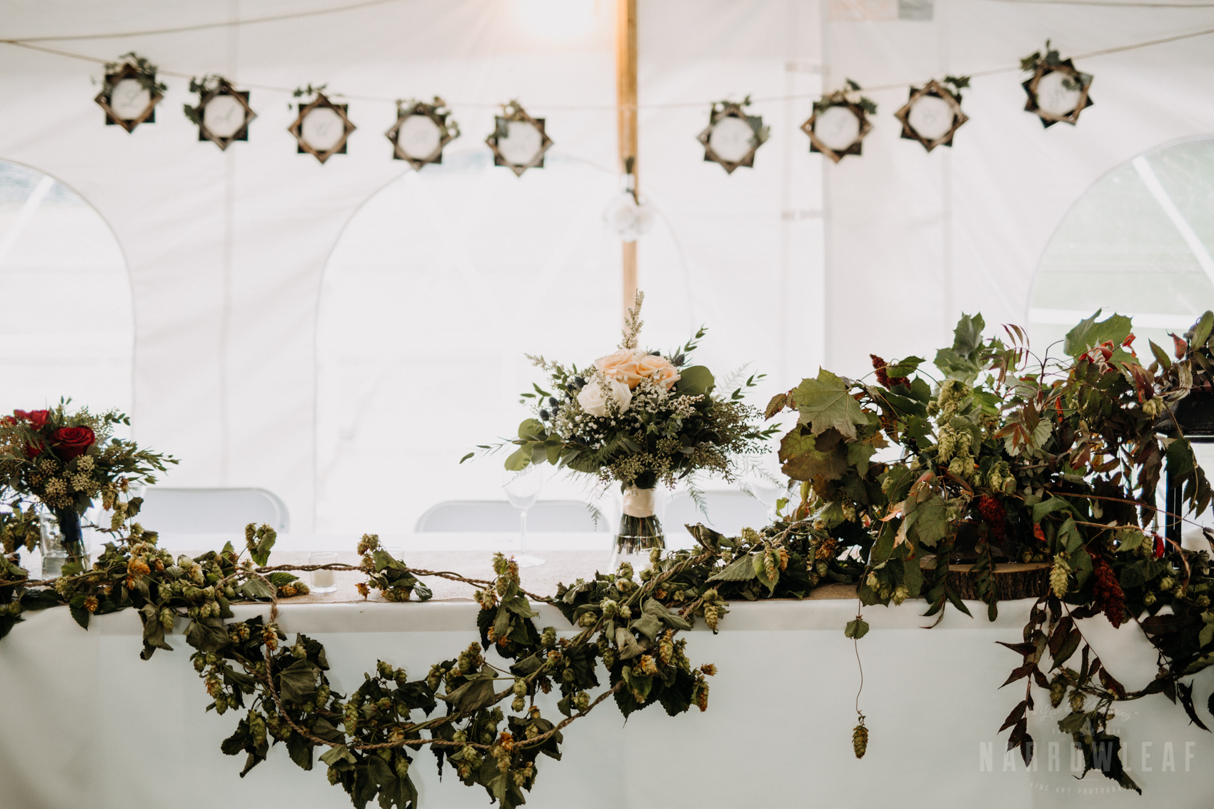 greenery-vine-head-table-decor-tent-wedding-reception-32.jpg