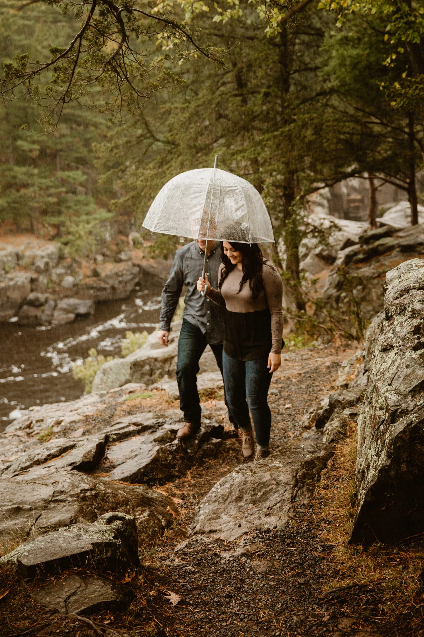 Wisconsin engagement photos hiking in the rain at Interstate Park.