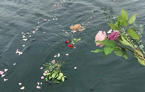 flowers-sea-burial-peaceful-cp.jpg