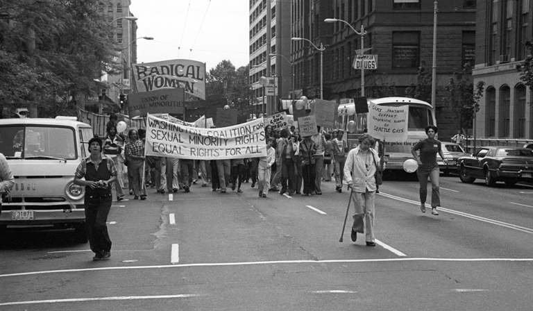    The head of the first Gay Pride Week march in Seattle (1977) Negative No. 2002.46.2379.5, Robert H. Miller Collection, Museum of History &amp; Industry   