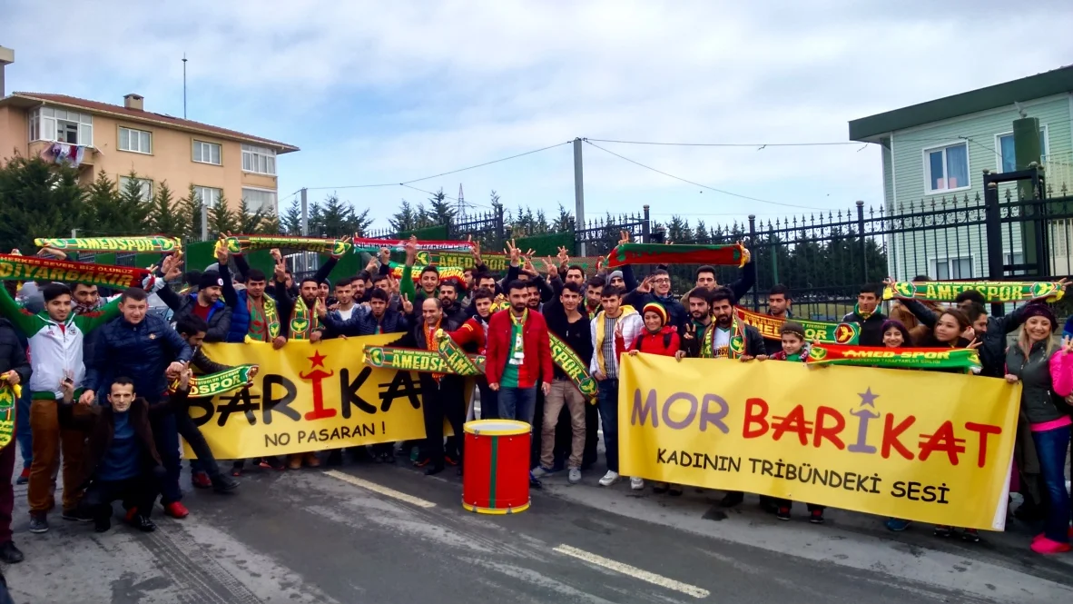 Amedspor fans ahead of a Turkish Cup match against Istanbul Basaksehir in 2016. The fan group name 'Barikat' means 'Barricade'. 'Mor Barikat' - 'Purple Barricade' - is a female Amedspor fan group.