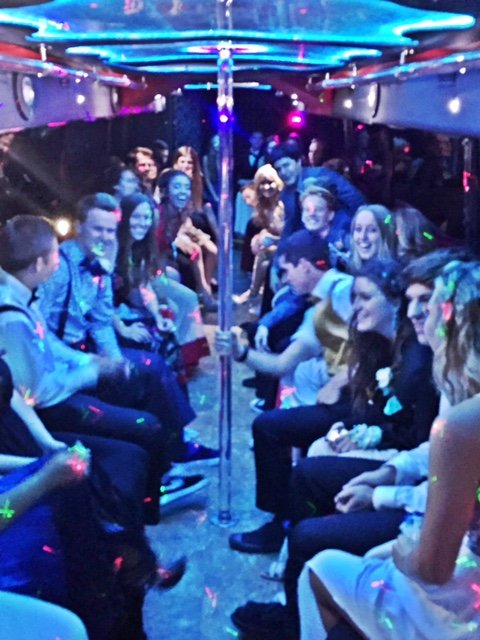 Formal-Wear-Kids-On-The-Way-To-Graduation-In-A-Limo-Bus-With-Friends