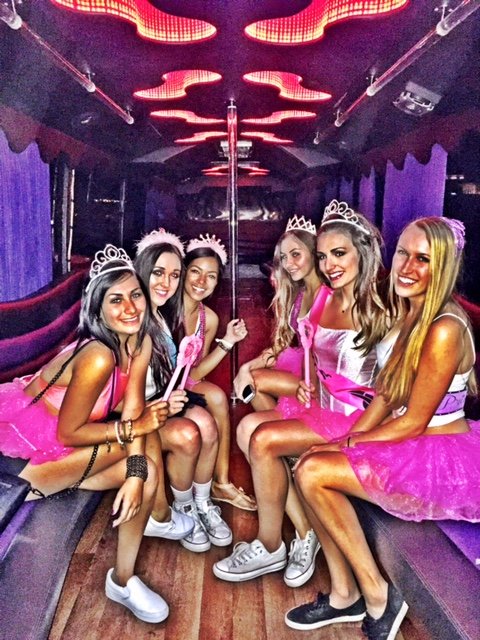 ladies-in-pink-celebrating-a-bachelorette-party-bus-in-downtown-san-diego