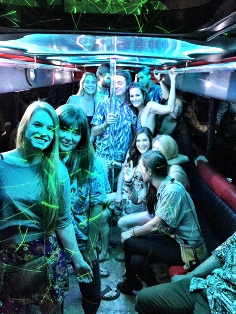 Laser-Lights-And-Girls-Smiling-In-A-Large-Partybus