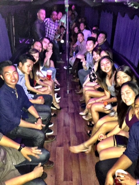 Relaxed-Group-Of-People-Leaving-For-Omnia-In-Downtown-SD-Inside-A-Extra-Large-Party-Bus