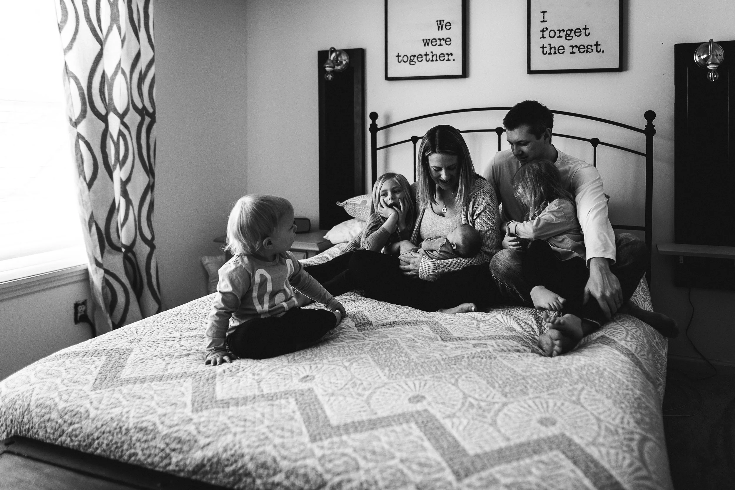 sister watching family on the bed