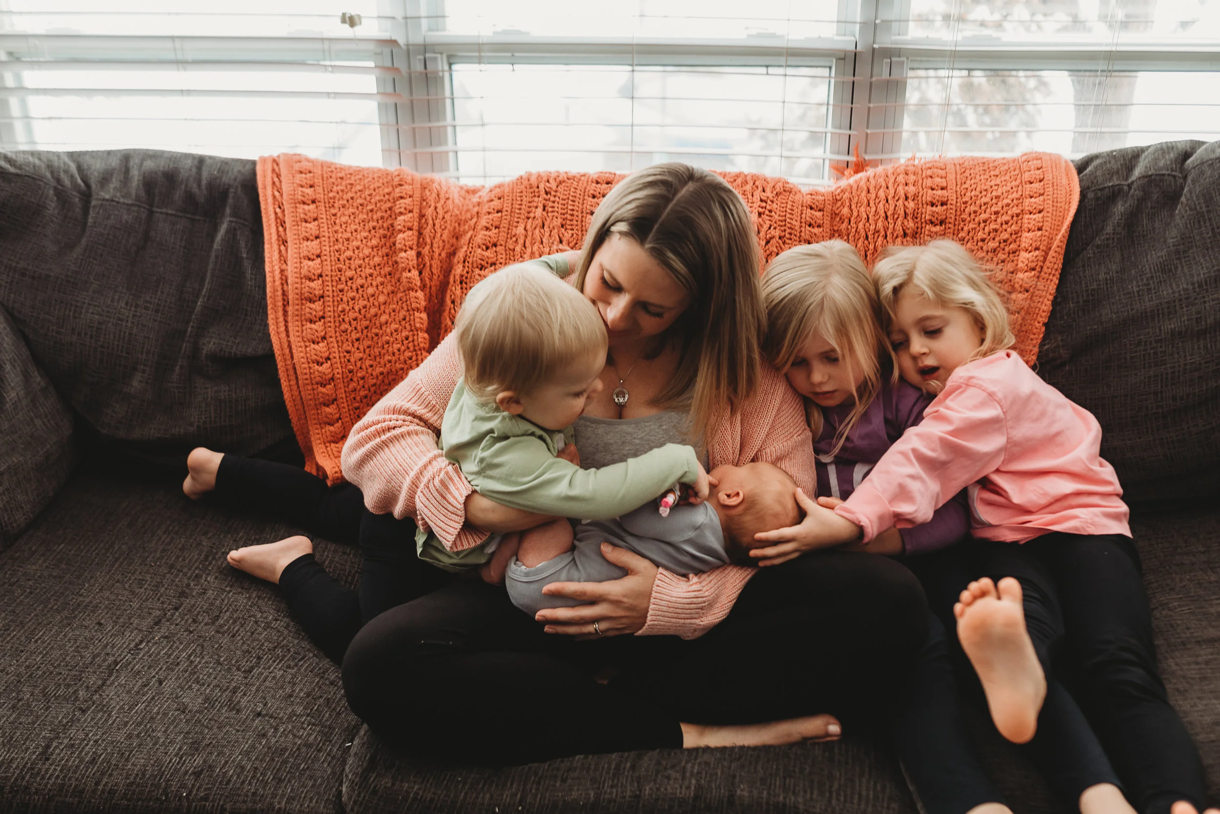 sisters with new baby