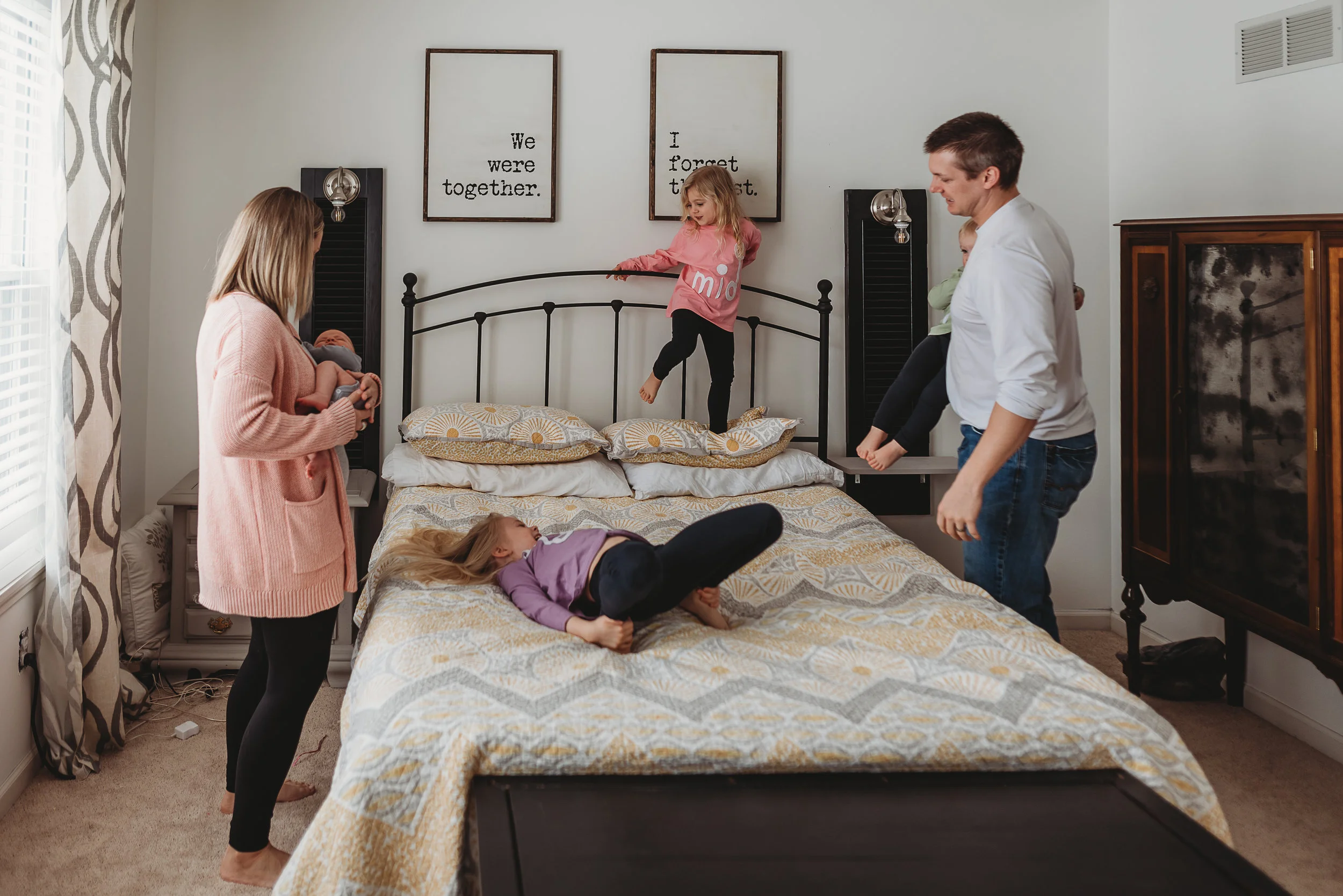 family in master bedroom