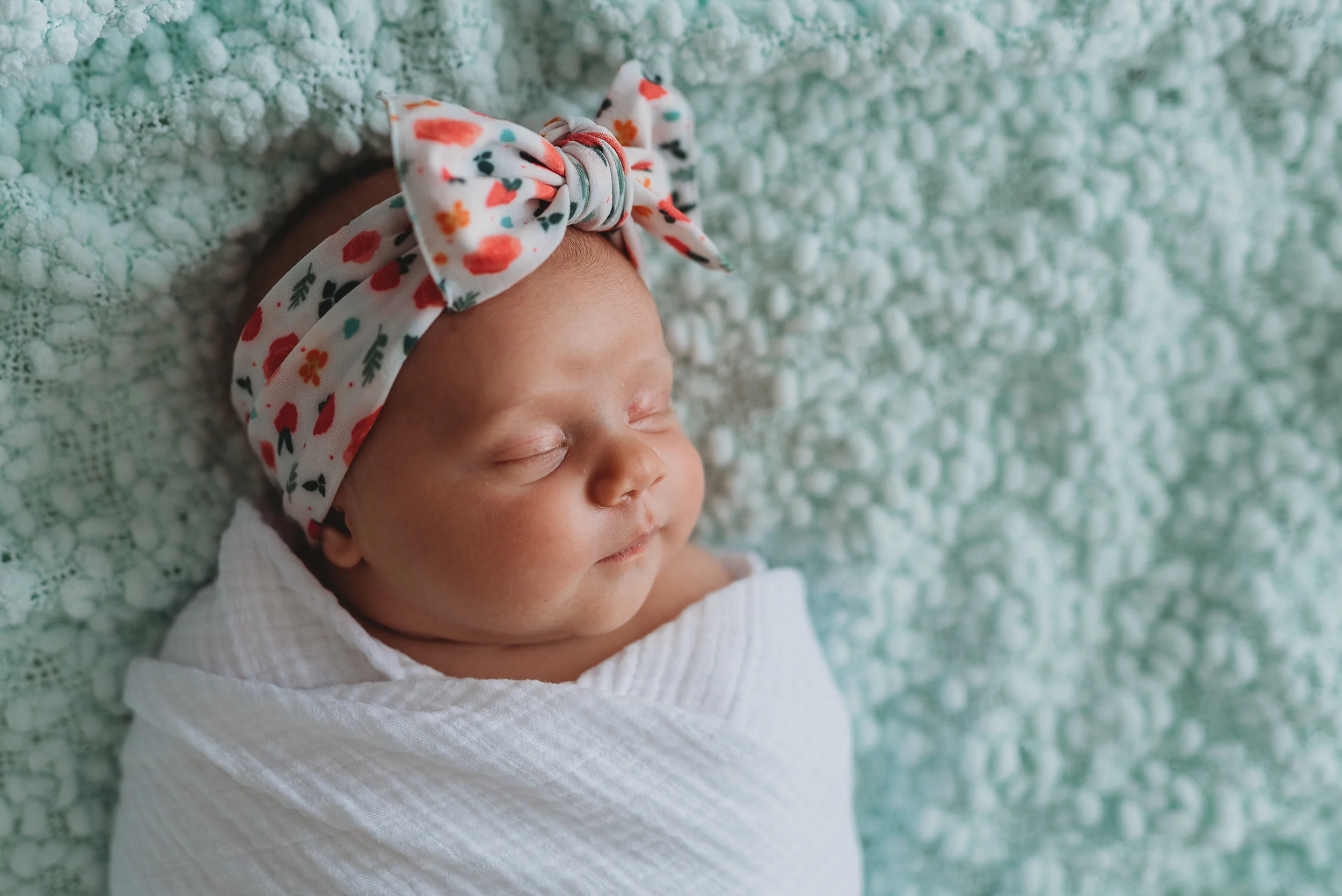 newborn girl on blanket