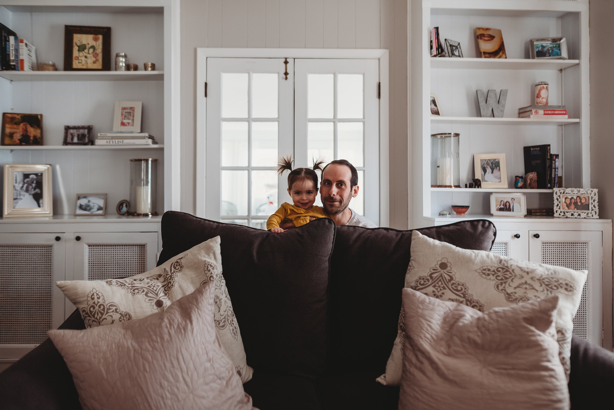 dad playing with little girl