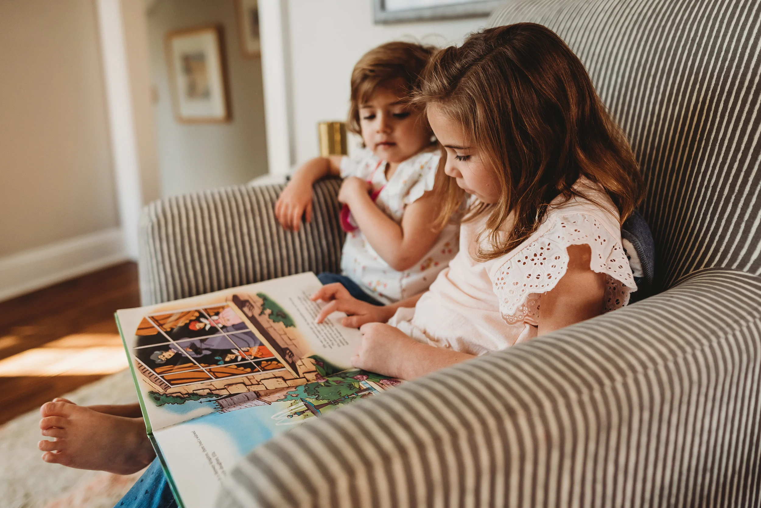 little girls looking at a book- St. Louis baby photographer