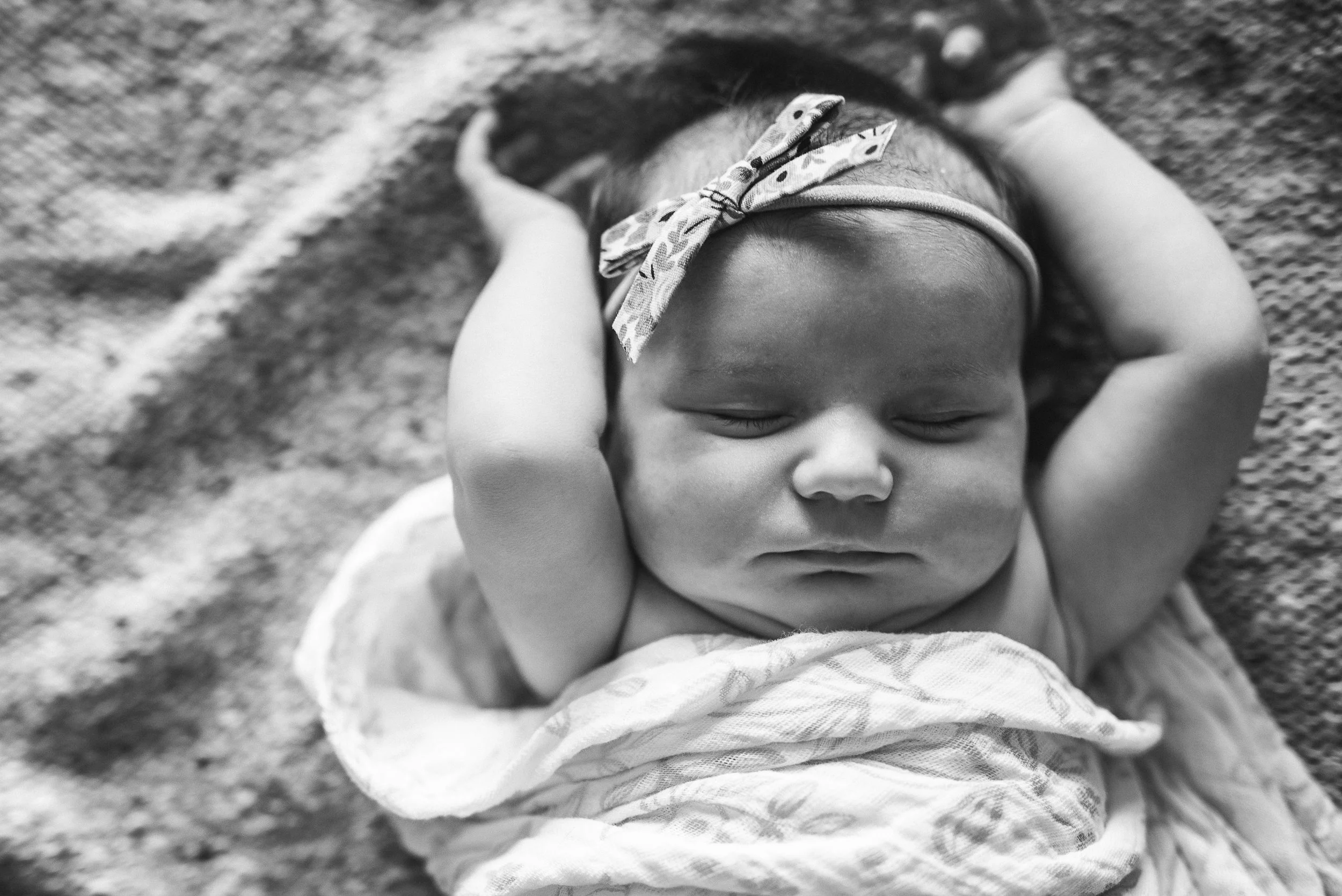 baby with arms up- St. Louis in home newborn