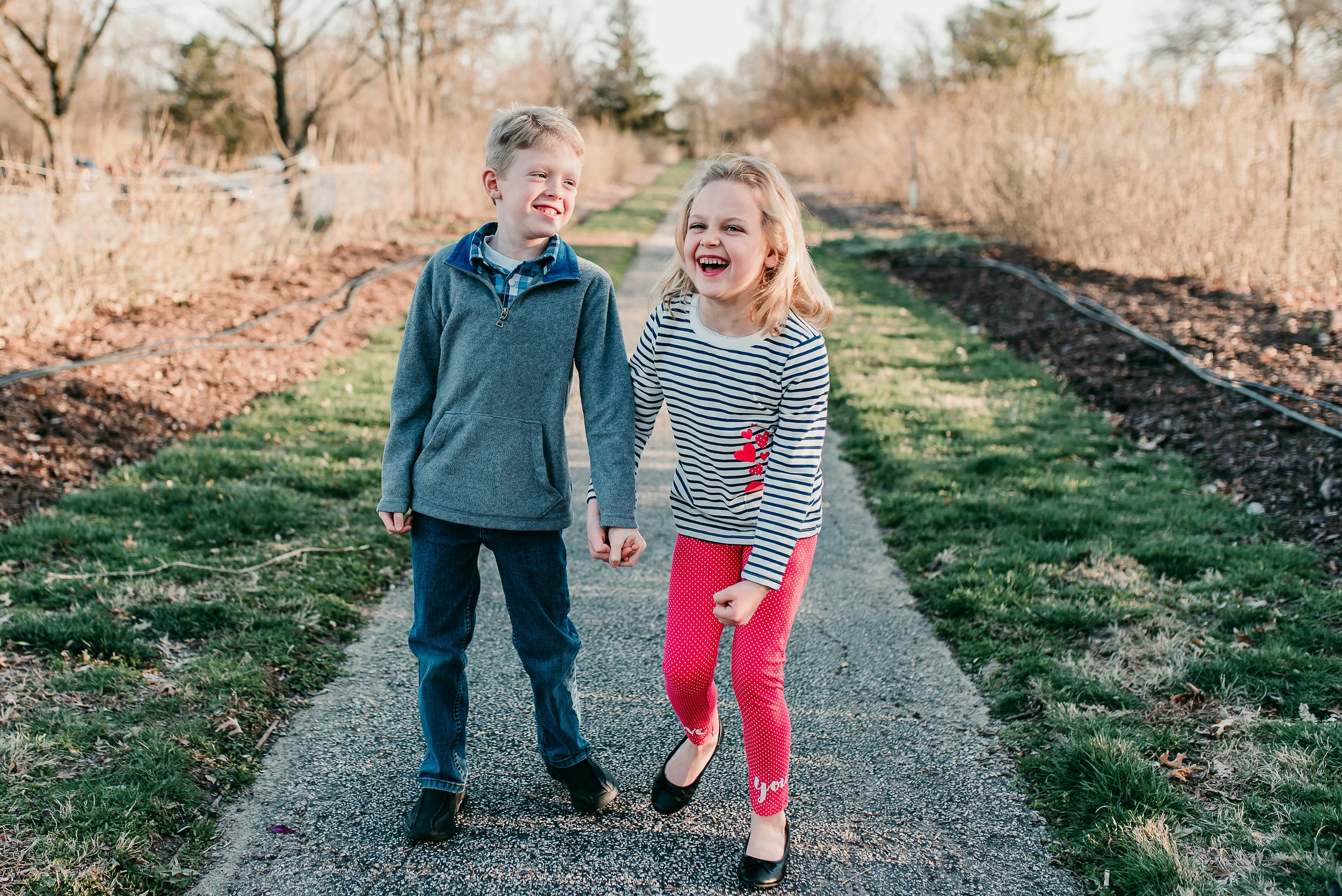 siblings laughing together- St. Louis family photographer