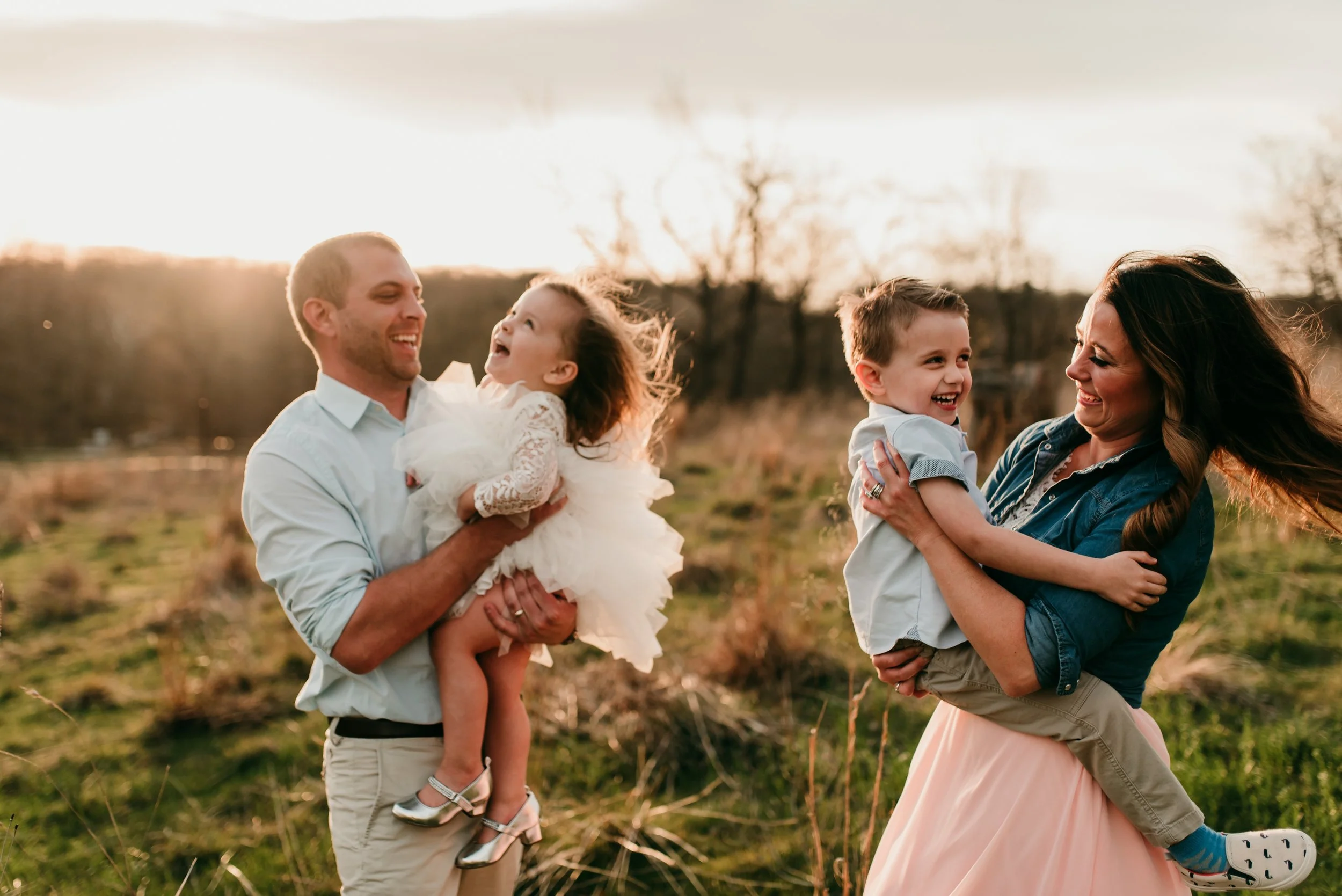 family laughing and playing St. Louis Lifestyle photographer