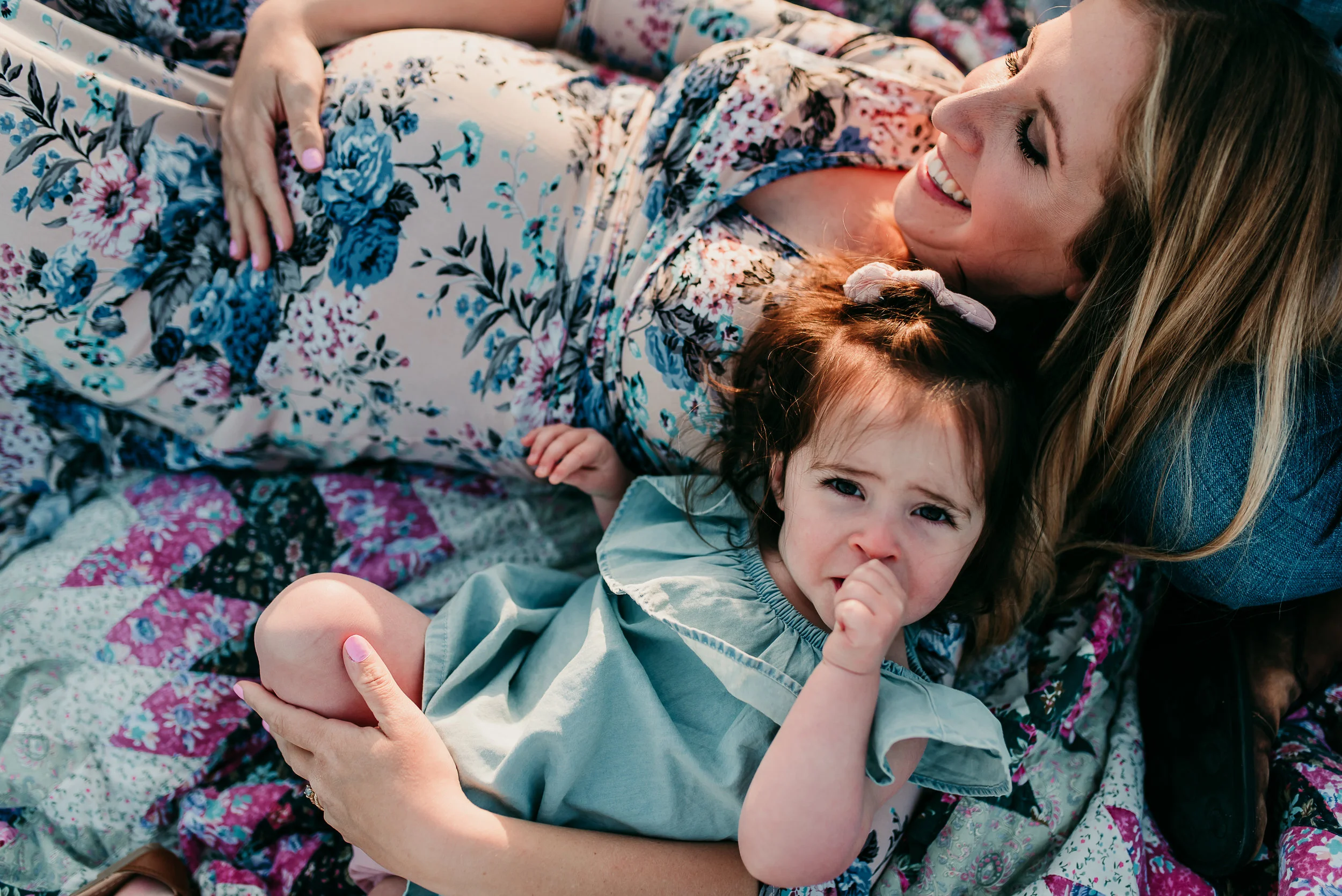 mom laying with daughter
