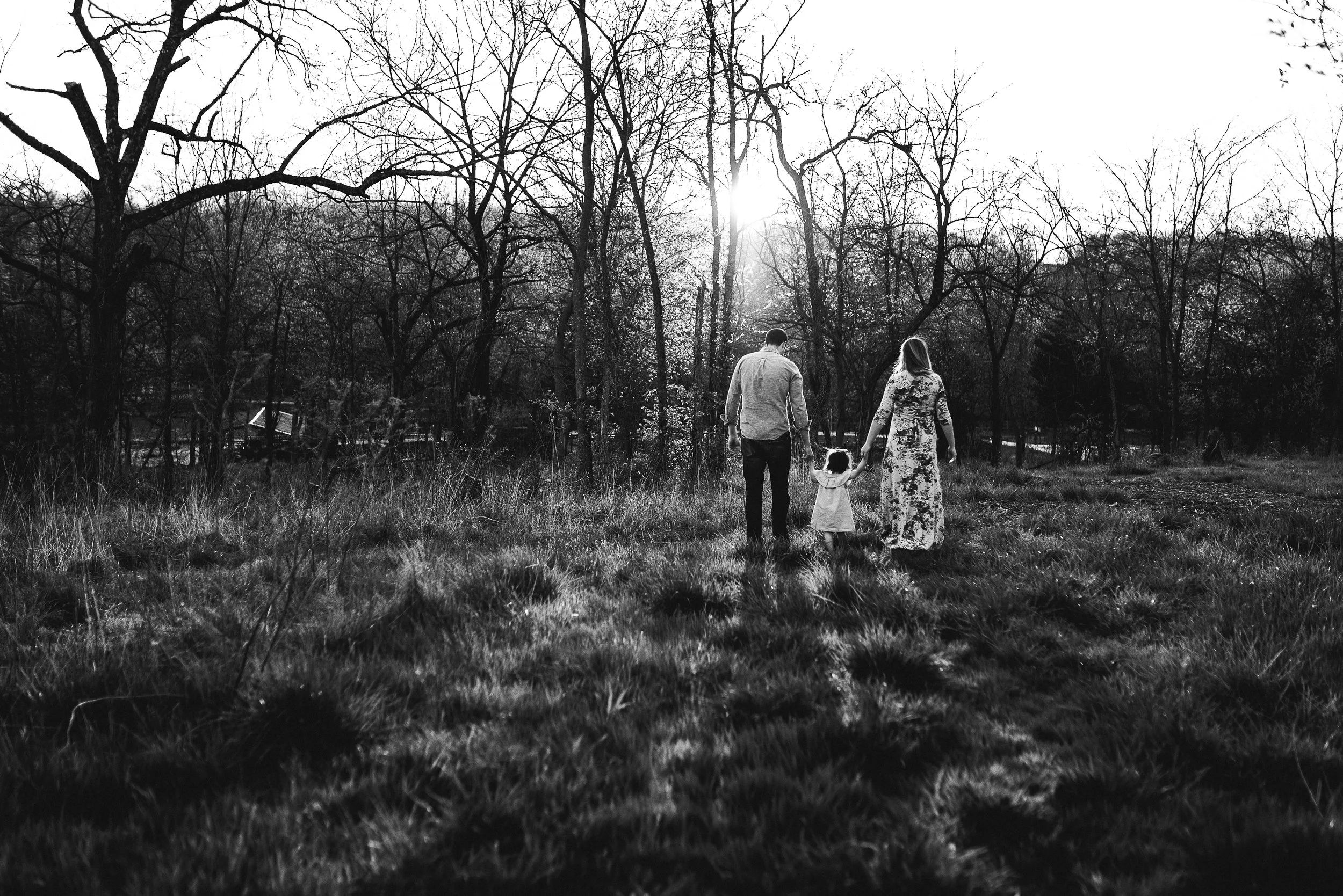 family walking into the sunset