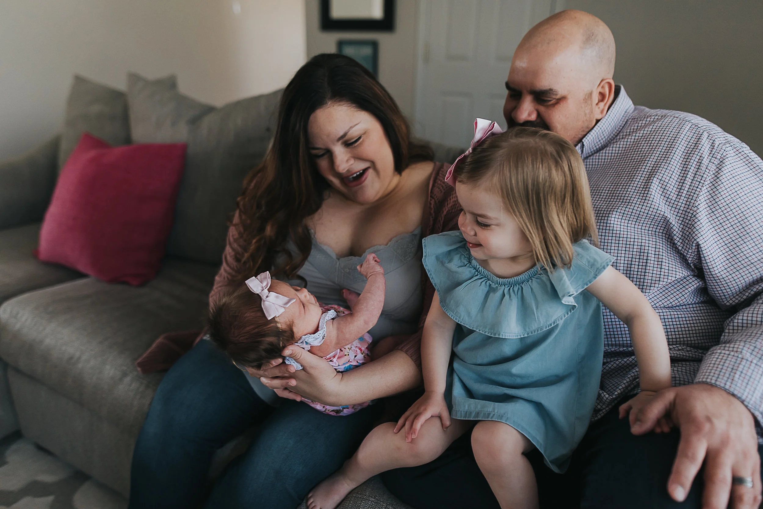 family looking at the baby